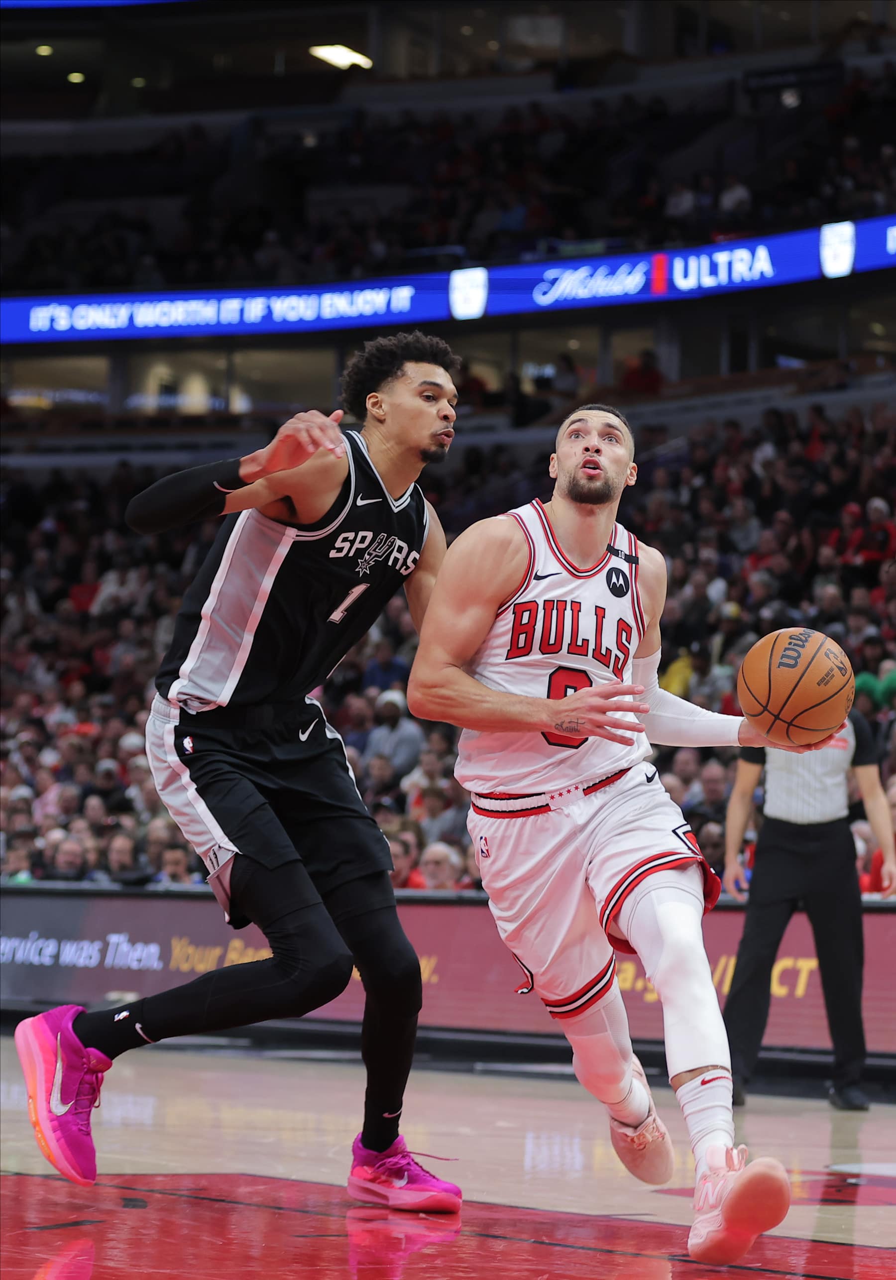 CHICAGO, IL - JANUARY 06:  Zach LaVine #8 of the Chicago Bulls drives to the basket against Victor Wembanyama #1 of the San Antonio Spurs during the second half on January 6, 2025 at the United Center in Chicago, Illinois. (Photo by Melissa Tamez/Icon Sportswire via Getty Images)