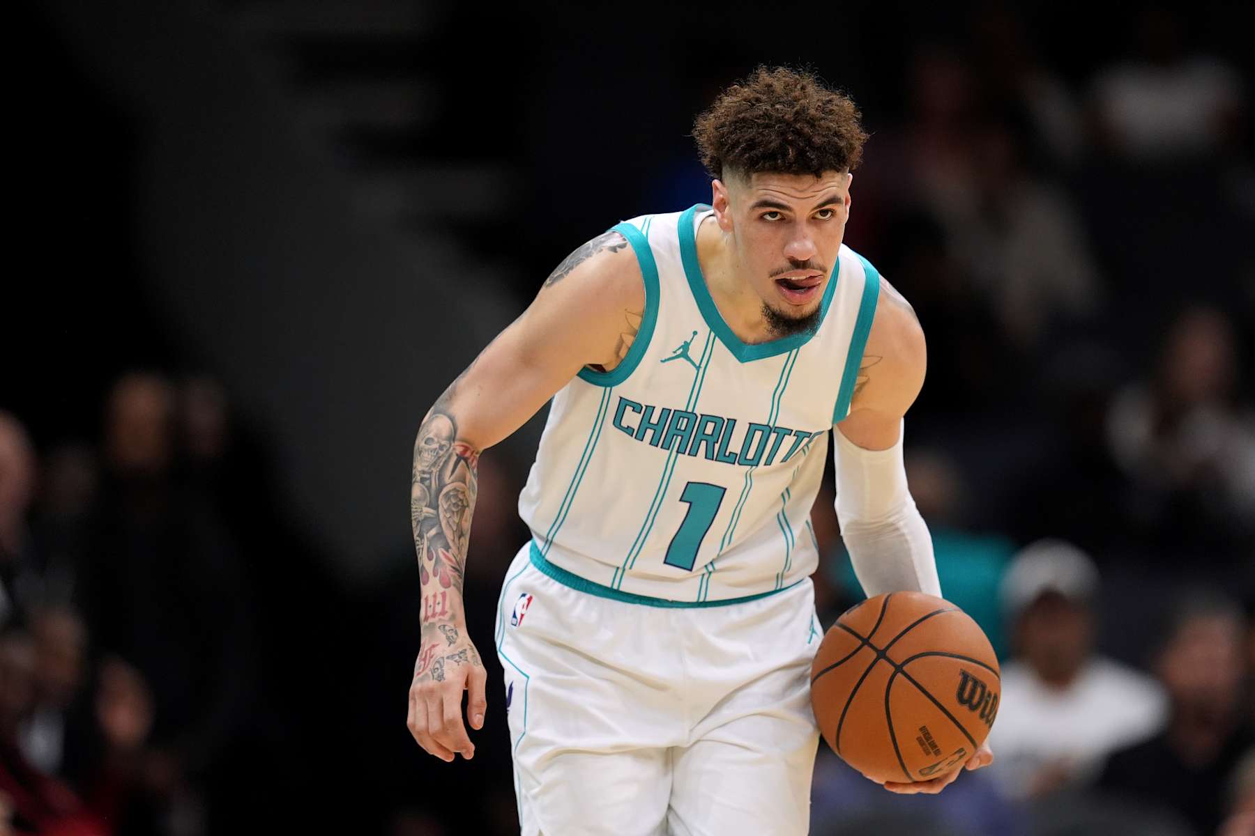 CHARLOTTE, NORTH CAROLINA - OCTOBER 08: LaMelo Ball #1 of the Charlotte Hornets moves the ball against the Miami Heat during the preseason game at Spectrum Center on October 08, 2024 in Charlotte, North Carolina. NOTE TO USER: User expressly acknowledges and agrees that, by downloading and or using this photograph, User is consenting to the terms and conditions of the Getty Images License Agreement. (Photo by Grant Halverson/Getty Images)
