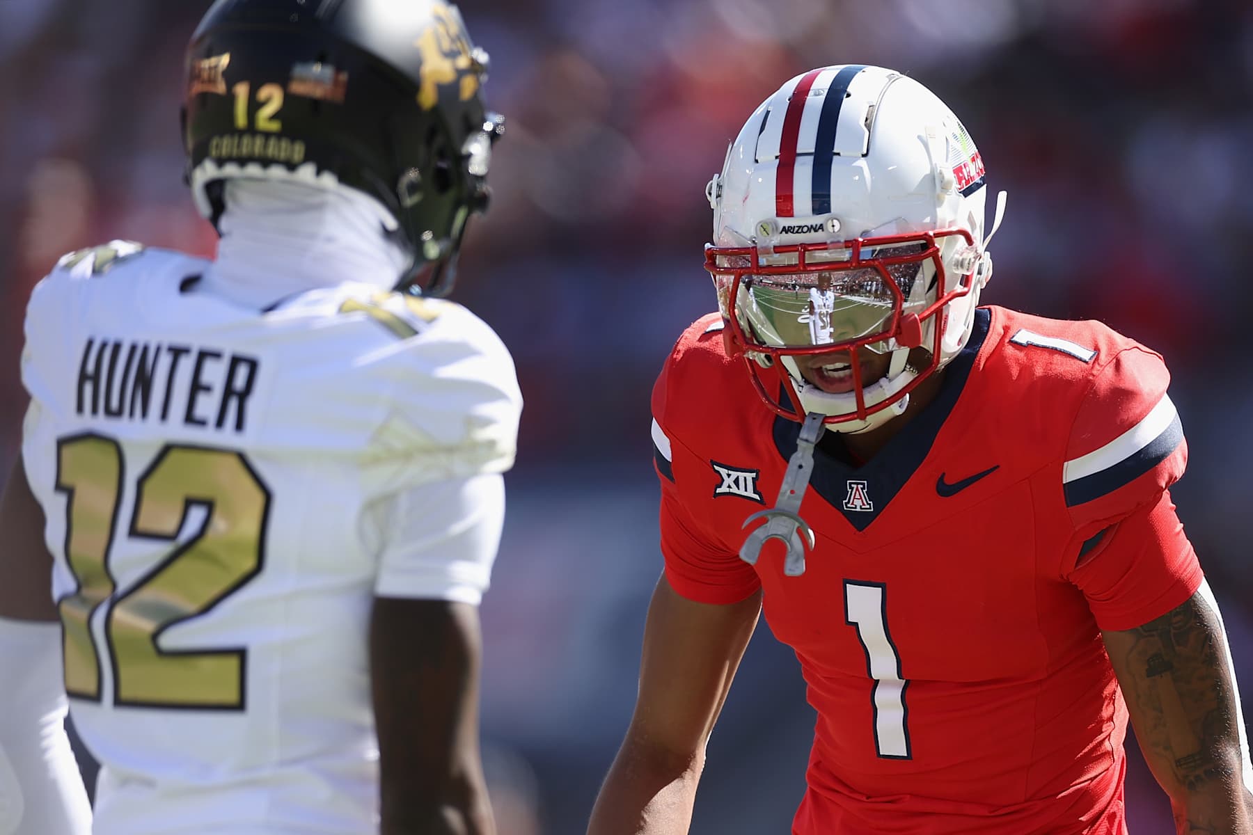 TUCSON, ARIZONA - OCTOBER 19: Defensive back Tacario Davis #1 of the Arizona Wildcats lines up against Travis Hunter #12 of the Colorado Buffaloes during the NCAAF game at Arizona Stadium on October 19, 2024 in Tucson, Arizona.  The Buffalos defeated the Wildcats 34-7.  (Photo by Christian Petersen/Getty Images)