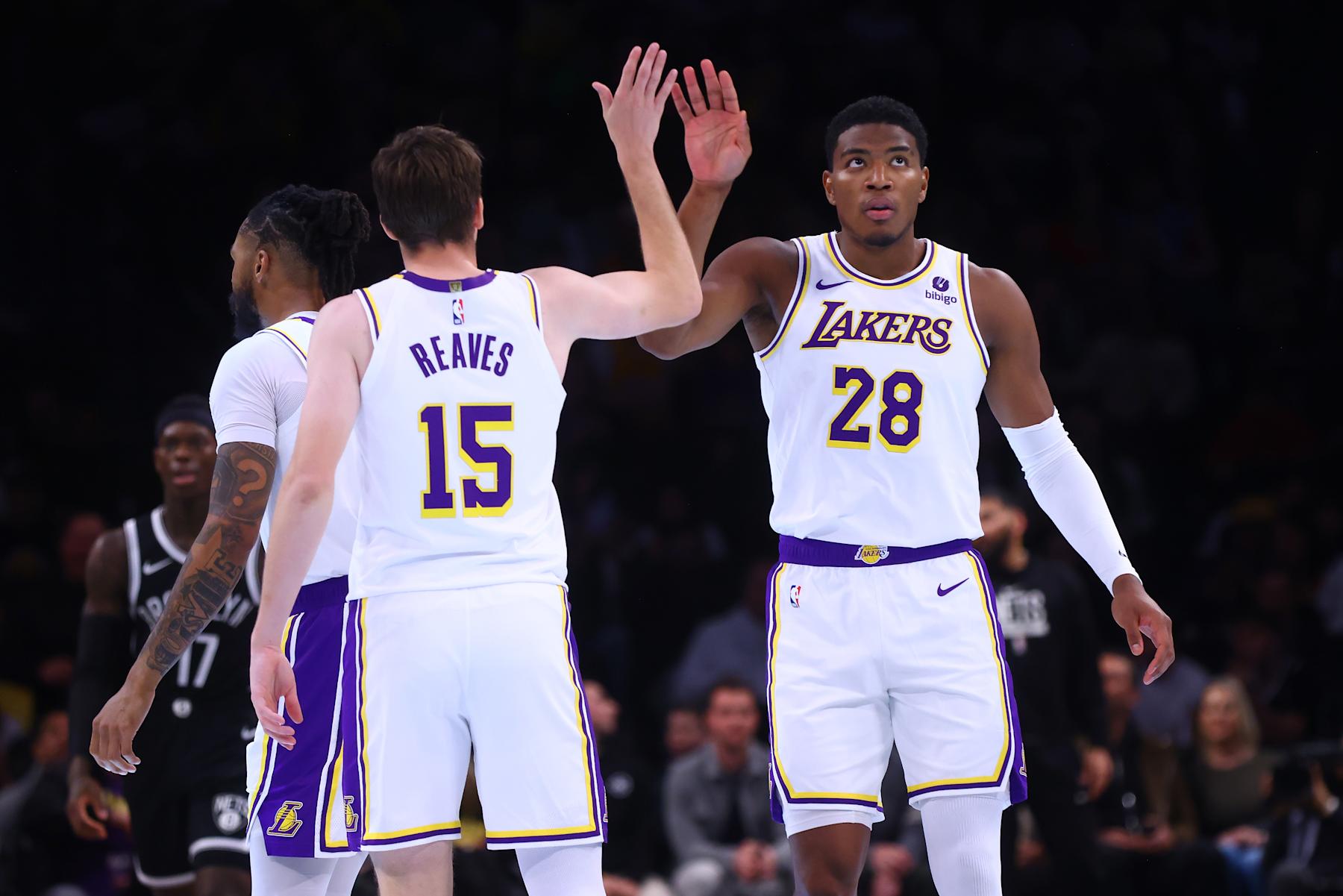 NEW YORK, NEW YORK - MARCH 31: Rui Hachimura #28 and Austin Reaves #15 of the Los Angeles Lakers celebrate against the Brooklyn Nets at Barclays Center on March 31, 2024 in New York City. NOTE TO USER: User expressly acknowledges and agrees that, by downloading and or using this photograph, User is consenting to the terms and conditions of the Getty Images License Agreement. (Photo by Mike Stobe/Getty Images)