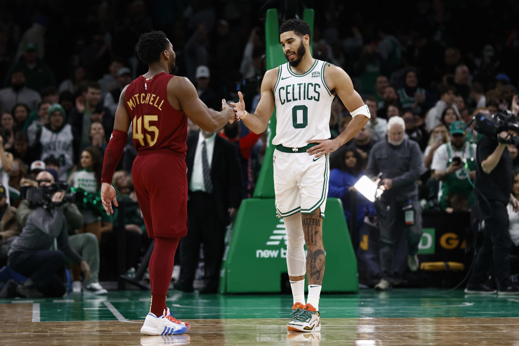 BOSTON, MA - DECEMBER 14: Jayson Tatum #0 of the Boston Celtics and Donovan Mitchell #45 of the Cleveland Cavaliers after their game at TD Garden on December 14, 2023 in Boston, Massachusetts. NOTE TO USER: User expressly acknowledges and agrees that, by downloading and/or using this Photograph, user is consenting to the terms and conditions of the Getty Images License Agreement. (Photo By Winslow Townson/Getty Images)
