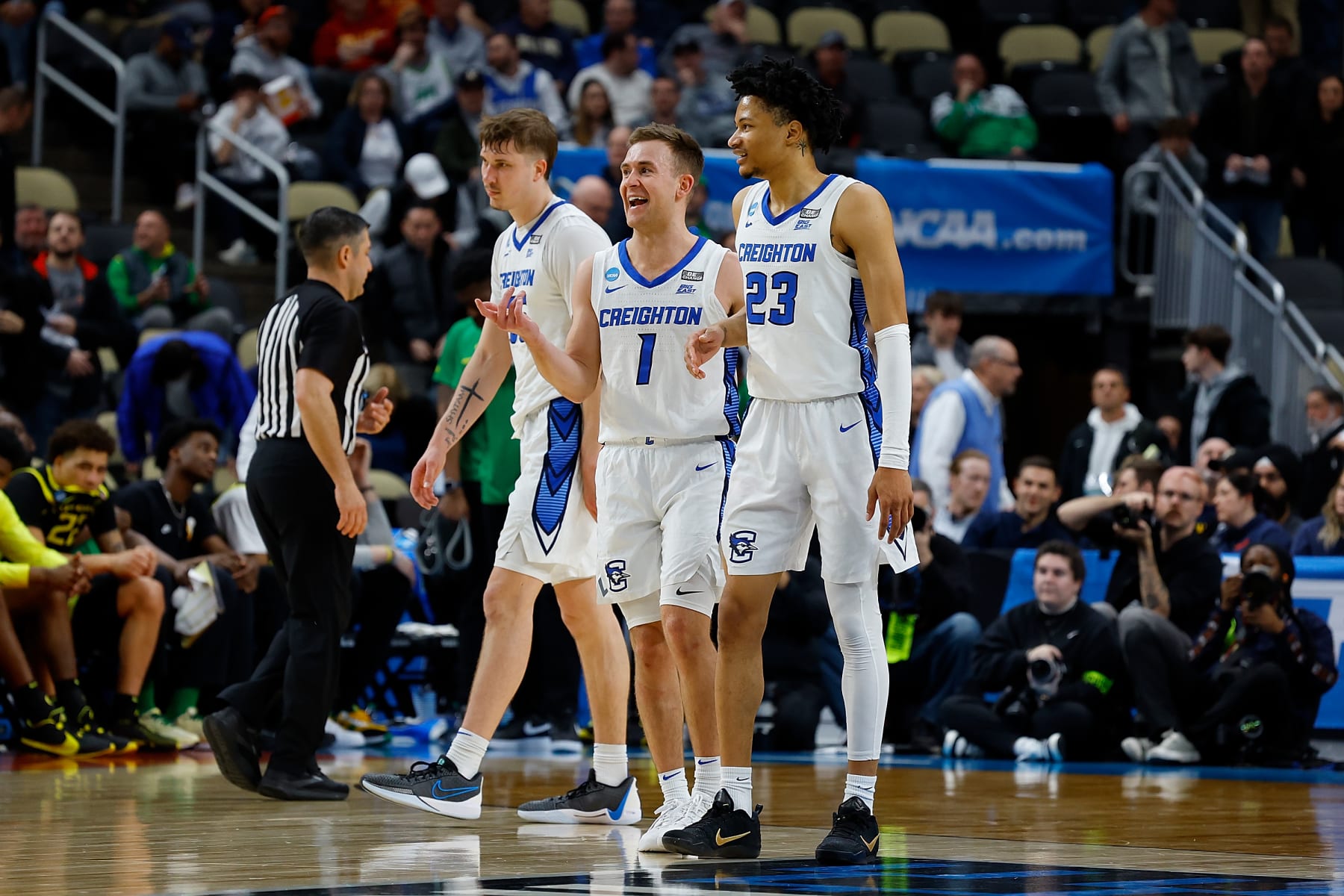 PITTSBURGH, PENNSYLVANIA - MARCH 23: Steven Ashworth #1 of the Creighton Bluejays talks with Trey Alexander #23 in the second overtime of the game against the Oregon Ducks during the second round of the 2024 NCAA Men's Basketball Tournament held at PPG PAINTS Arena on March 23, 2024 in Pittsburgh, Pennsylvania. (Photo by Justin K. Aller/NCAA Photos via Getty Images)