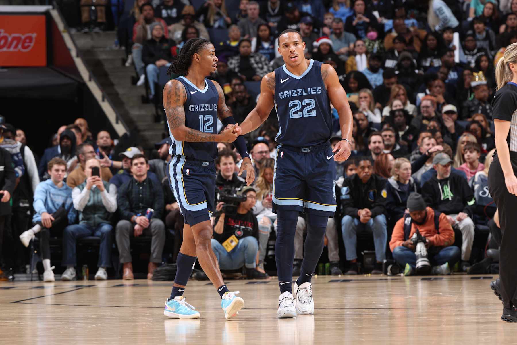 MEMPHIS, TN - DECEMBER 21: Ja Morant #12 of the Memphis Grizzlies high fives Desmond Bane #22 of the Memphis Grizzlies during the game against the Indiana Pacers on December 21, 2023 at FedExForum in Memphis, Tennessee. NOTE TO USER: User expressly acknowledges and agrees that, by downloading and or using this photograph, User is consenting to the terms and conditions of the Getty Images License Agreement. Mandatory Copyright Notice: Copyright 2023 NBAE (Photo by Joe Murphy/NBAE via Getty Images)