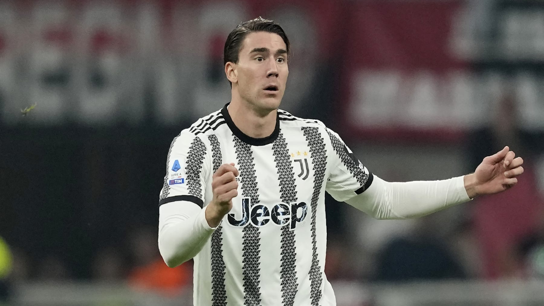 Juventus' Dusan Vlahovic controls the ball during the Serie A soccer match between AC Milan and Juventus at the San Siro stadium, in Milan, Italy, Saturday, Oct. 8, 2022. (AP Photo/Antonio Calanni)