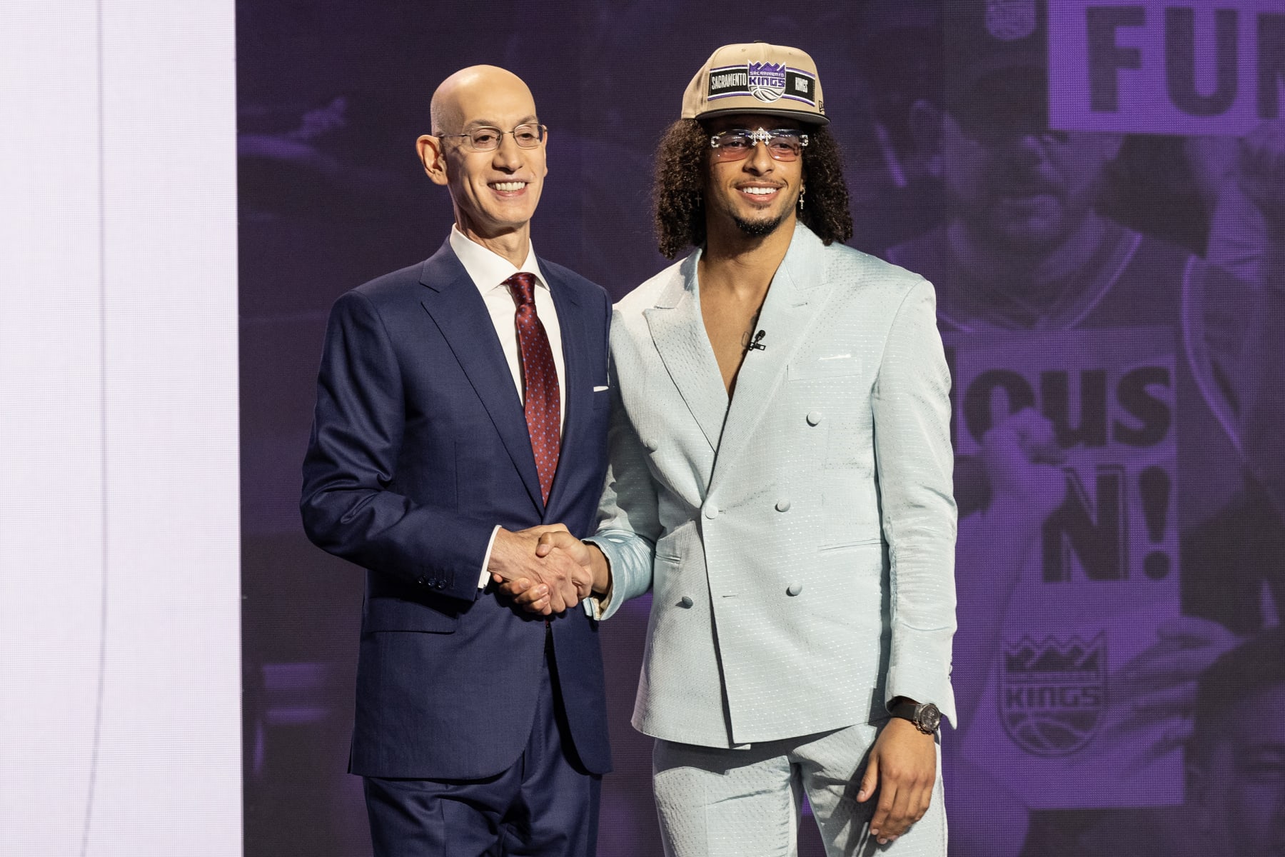 NEW YORK, UNITED STATES - JUNE 26: Commissioner Adam Silver shakes hands with Devin Carter, selected as number thirteen by the Sacramento Kings, in the first round of the 2024 NBA Draft at the Barclays Center in Brooklyn, New York, United States on June 26, 2024 (Photo by Lev Radin/Anadolu via Getty Images)