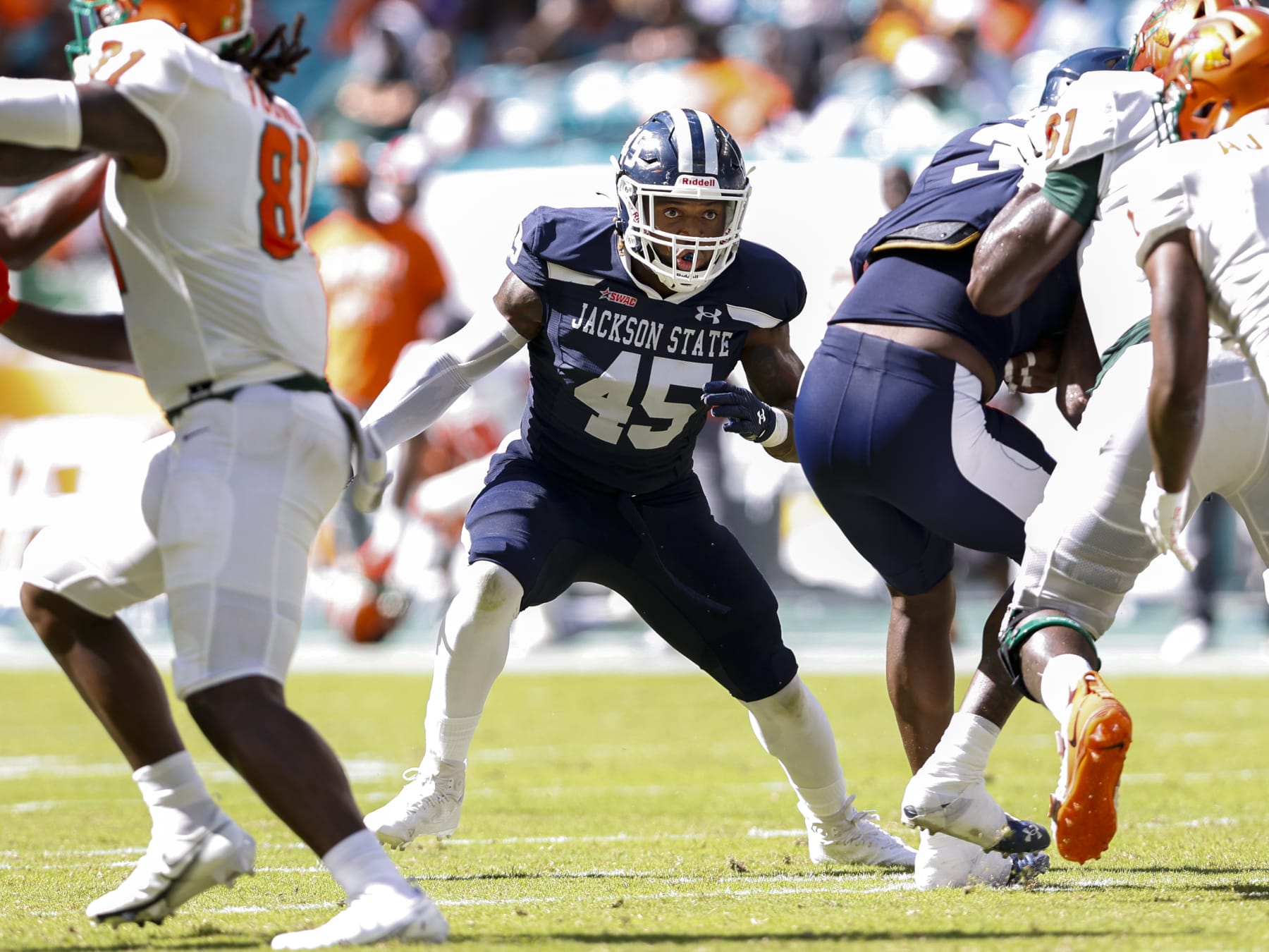 MIAMI GARDENS, FLORIDA - SEPTEMBER 04: Linebacker Aubrey Miller, Jr. #45 of the Jackson State Tigers defends on a running play against the Florida A&M Rattlers during the Orange Blossom Classic Game at Hard Rock Stadium on September 04, 2022 in Miami Gardens, Florida. The Tigers defeated the Rattlers 59-3. (Photo by Don Juan Moore/Getty Images)