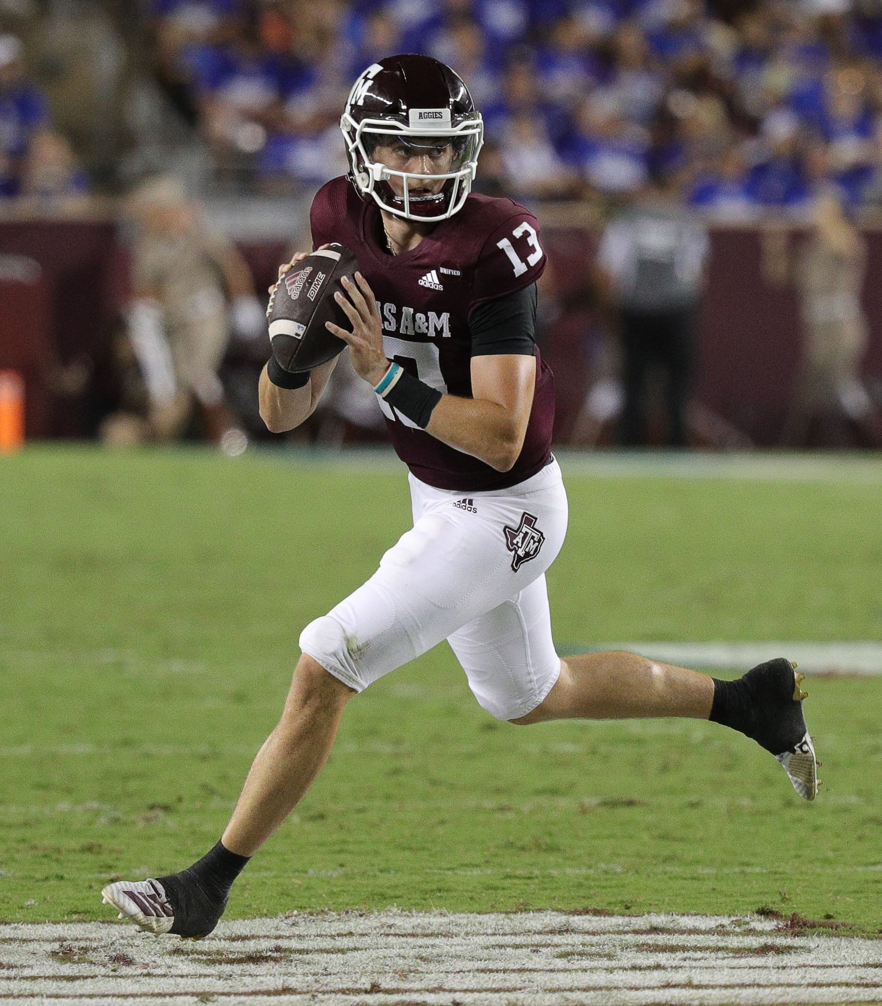 COLLEGE STATION, TEXAS - SEPTEMBER 04: Haynes King #13 of the Texas A&M Aggies rolls out for a pass in the second quarter against the Kent State Golden Flashes at Kyle Field on September 04, 2021 in College Station, Texas. (Photo by Bob Levey/Getty Images)