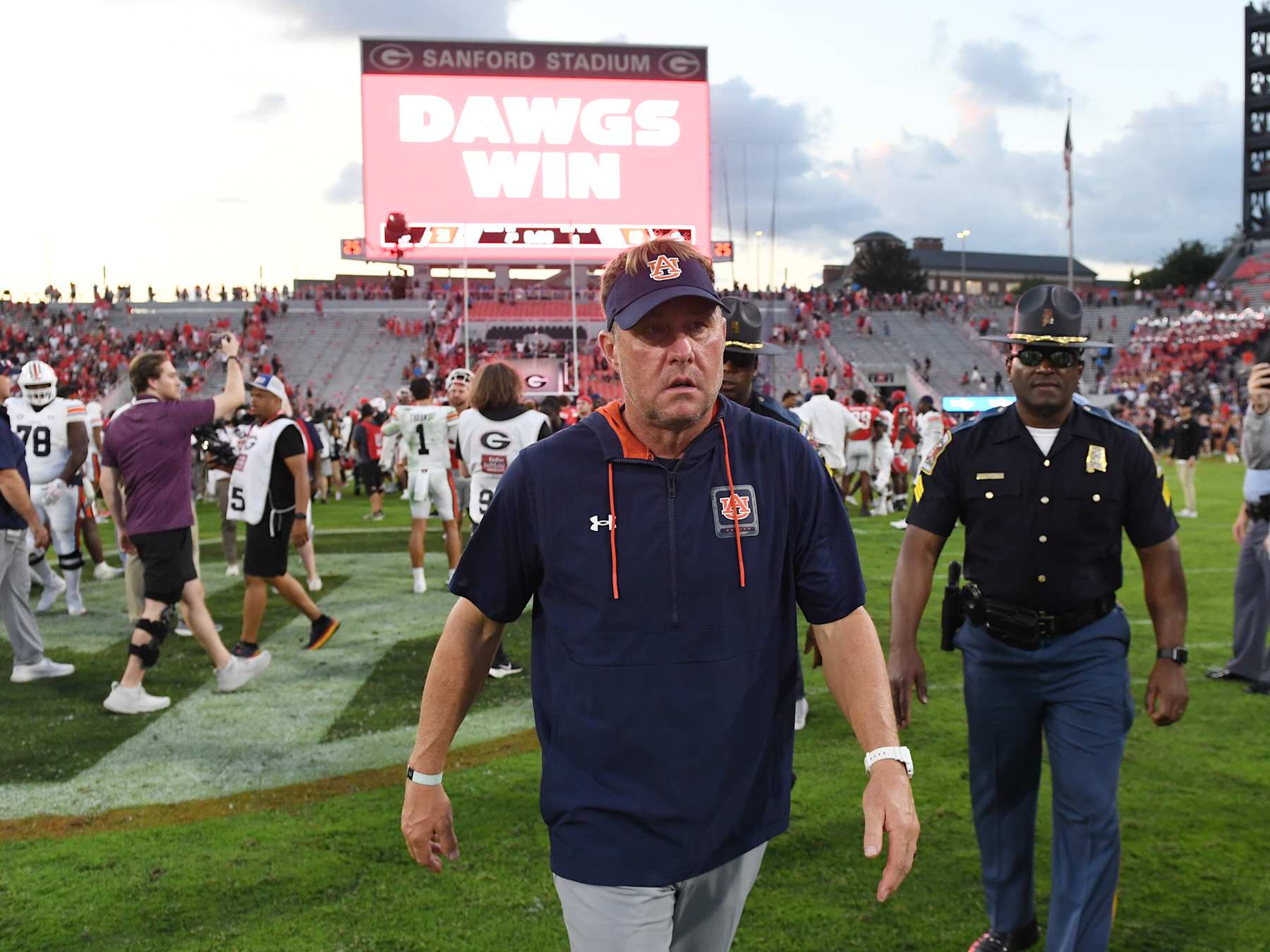 ATHENS, GA - OCTOBER 05: A defeated Auburn Tigers head coach Hugh Freeze walks off the field after the college football game between the Auburn Tigers and the Georgia Bulldogs on October 05, 2024, at Sanford Stadium in Athens, GA. (Photo by Jeffrey Vest/Icon Sportswire via Getty Images)
