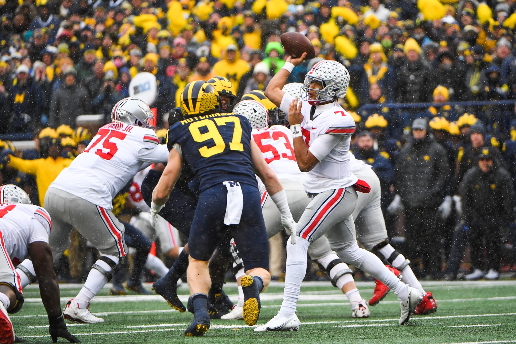 ANN ARBOR, MI - NOVEMBER 27: Ohio State Buckeyes quarterback C.J. Stroud (7) throws outside with Michigan Wolverines defensive end Aidan Hutchinson (97) rushing during The Michigan Wolverines vs the Ohio State Buckeyes game on Saturday November 27, 2021 at Michigan Stadium in Ann Arbor, MI. (Photo by Steven King/Icon Sportswire via Getty Images)