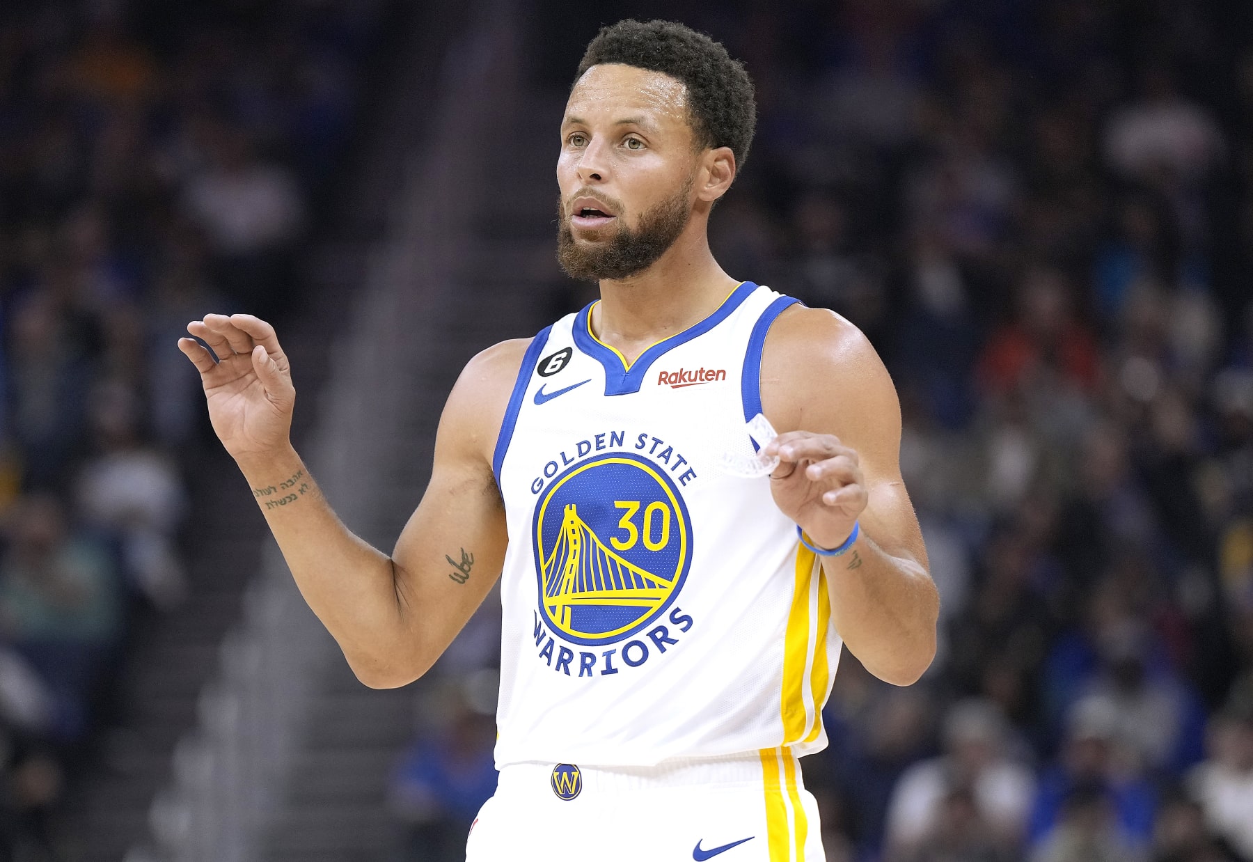 SAN FRANCISCO, CALIFORNIA - OCTOBER 14: Stephen Curry #30 of the Golden State Warriors looks on against the Denver Nuggets during the first half of an NBA basketball game at Chase Center on October 14, 2022 in San Francisco, California. NOTE TO USER: User expressly acknowledges and agrees that, by downloading and or using this photograph, User is consenting to the terms and conditions of the Getty Images License Agreement. (Photo by Thearon W. Henderson/Getty Images)