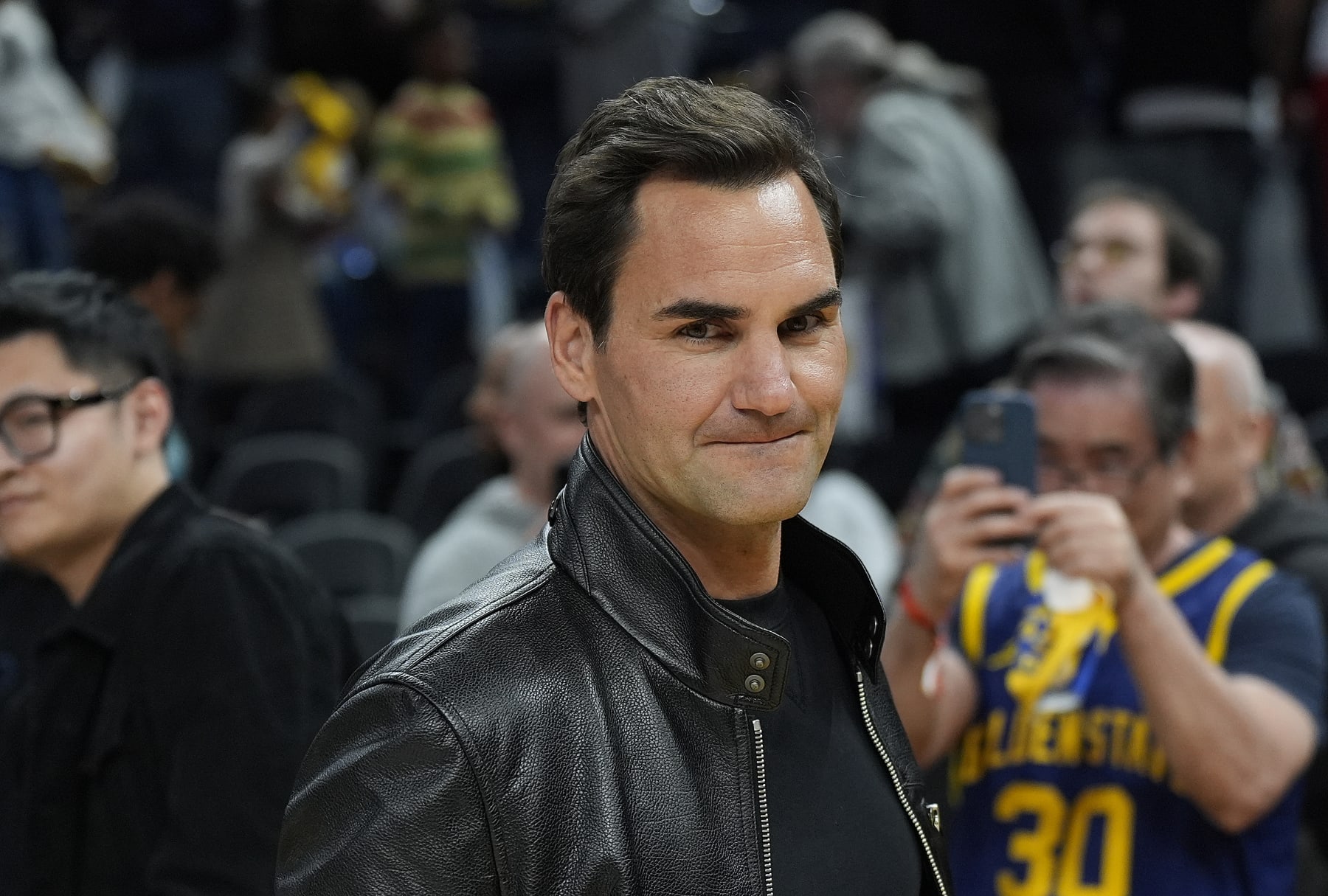 SAN FRANCISCO, CALIFORNIA - MARCH 09: Tennis legend Roger Federer looks on walking off the court after the game between the San Antonio Spurs and Golden State Warriors at Chase Center on March 09, 2024 in San Francisco, California. NOTE TO USER: User expressly acknowledges and agrees that, by downloading and or using this photograph, User is consenting to the terms and conditions of the Getty Images License Agreement. (Photo by Thearon W. Henderson/Getty Images)