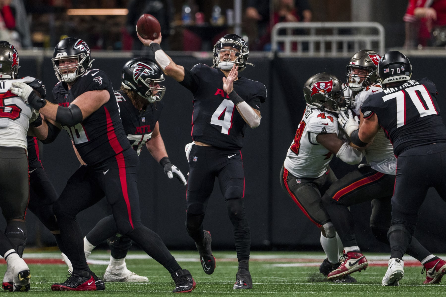 Atlanta Falcons quarterback Desmond Ridder (4) works during the second half of an NFL football game against the Tampa Bay Buccaneers, Sunday, Jan. 8, 2023, in Atlanta. The Atlanta Falcons won 30-17. (AP Photo/Danny Karnik)