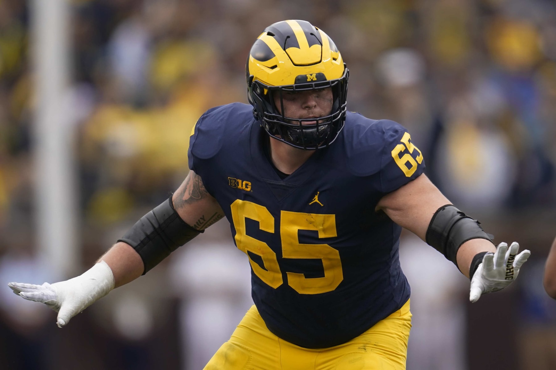 Michigan offensive lineman Zak Zinter (65) blocks against Maryland in the second half of an NCAA college football game in Ann Arbor, Mich., Saturday, Sept. 24, 2022. (AP Photo/Paul Sancya)
