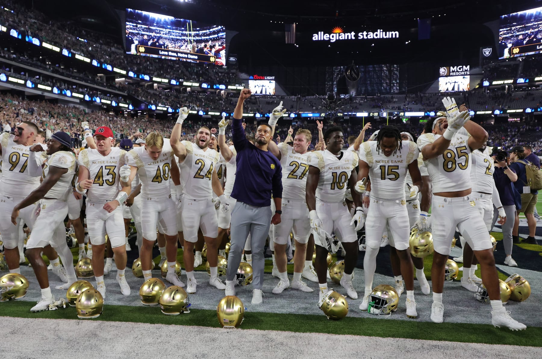 LAS VEGAS, NEVADA - OCTOBER 08: Head coach Marcus Freeman (C) of the Notre Dame Fighting Irish celebrates with his players after the team's 28-20 victory over the Brigham Young Cougars in the Shamrock Series game at Allegiant Stadium on October 08, 2022 in Las Vegas, Nevada. (Photo by Ethan Miller/Getty Images)