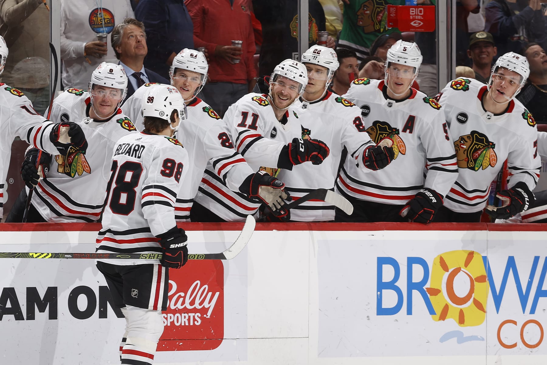 SUNRISE, FL - NOVEMBER 12: Teammates congratulate Connor Bedard #98 of the Chicago Blackhawks after he scored a second period goal against the Florida Panthers at the Amerant Bank Arena on November 12, 2023 in Sunrise, Florida. (Photo by Joel Auerbach/Getty Images)