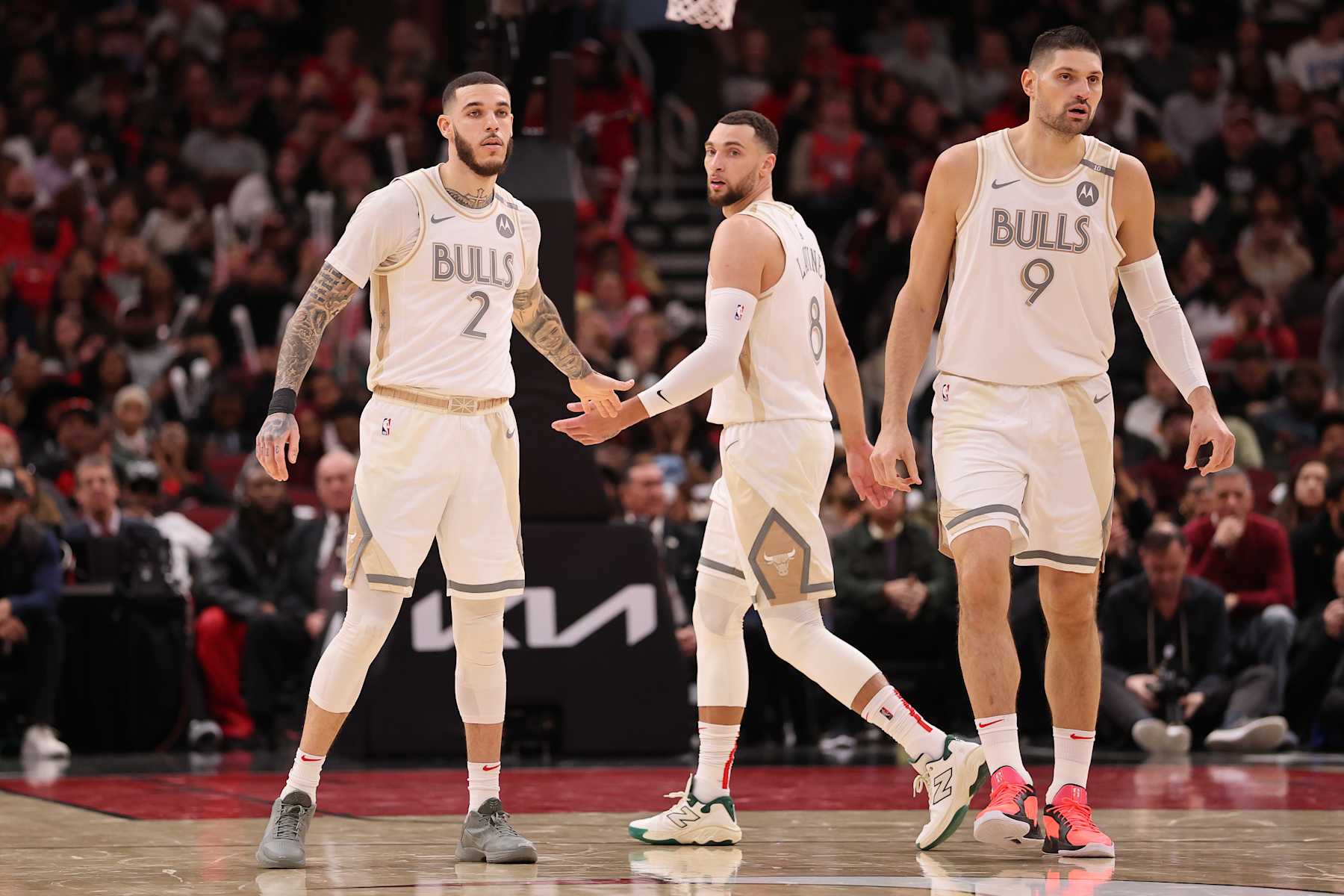 CHICAGO, ILLINOIS - JANUARY 25: Lonzo Ball #2, Zach LaVine #8 and Nikola Vucevic #9 of the Chicago Bulls look on against the Philadelphia 76ers during the second half at the United Center on January 25, 2025 in Chicago, Illinois. NOTE TO USER: User expressly acknowledges and agrees that, by downloading and or using this photograph, User is consenting to the terms and conditions of the Getty Images License Agreement.  (Photo by Michael Reaves/Getty Images)