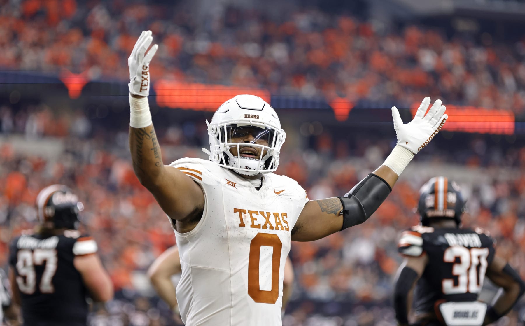 ARLINGTON, TX - DECEMBER 2: Tght end Ja'Tavion Sanders #0 of the Texas Longhorns celebrates after a touchdown against the Oklahoma State Cowboys in the first half of the Big 12  Championship at AT&T Stadium on December 2, 2023 in Arlington, Texas.  (Photo by Ron Jenkins/Getty Images)
