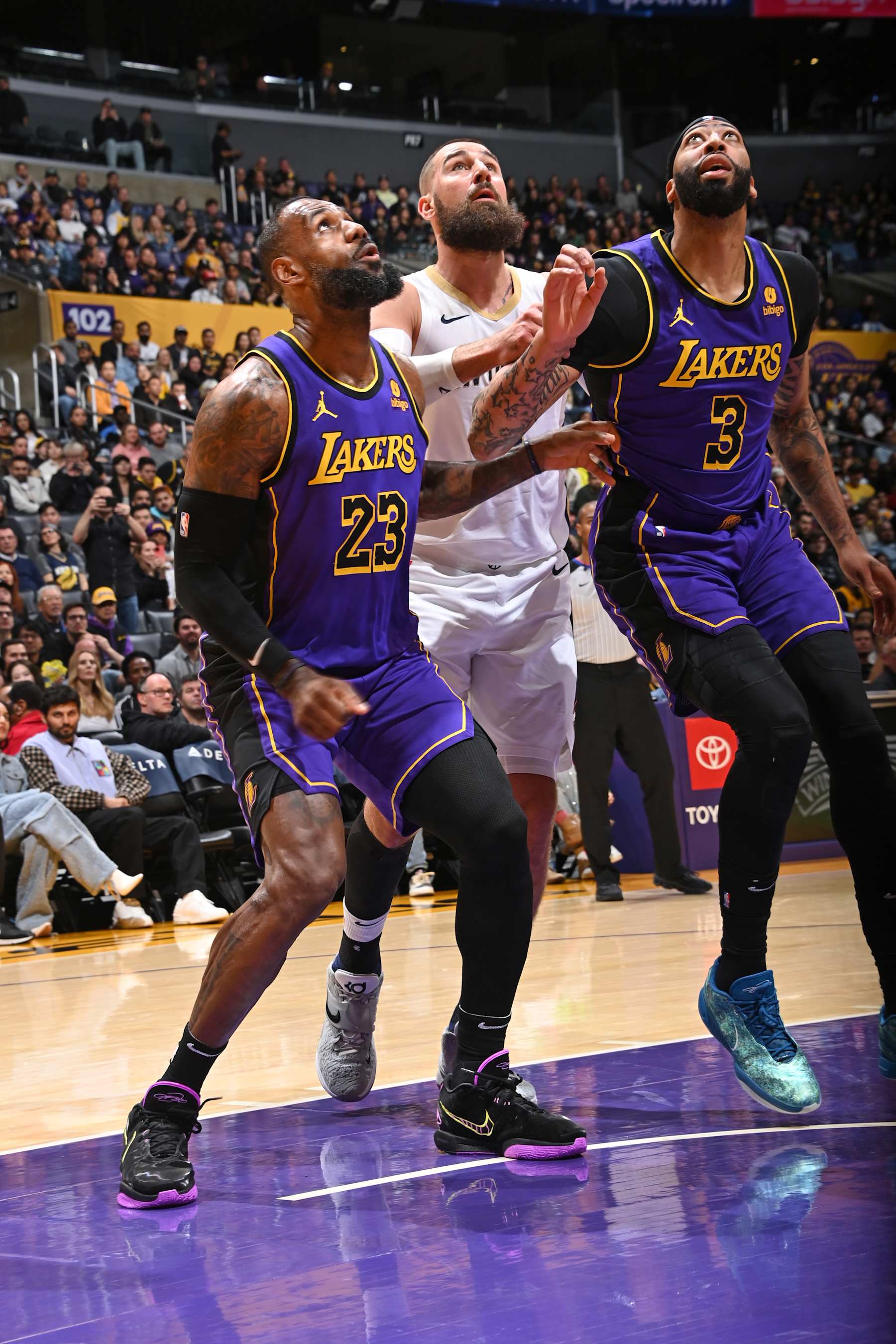 LOS ANGELES, CA - FEBRUARY 9: LeBron James #23 of the Los Angeles Lakers, Jonas Valanciunas #17 of the New Orleans Pelicans, and Anthony Davis #3 of the Los Angeles Lakers wait for a rebound during the game on February 9, 2024 at Crypto.Com Arena in Los Angeles, California. NOTE TO USER: User expressly acknowledges and agrees that, by downloading and/or using this Photograph, user is consenting to the terms and conditions of the Getty Images License Agreement. Mandatory Copyright Notice: Copyright 2024 NBAE (Photo by Andrew D. Bernstein/NBAE via Getty Images)