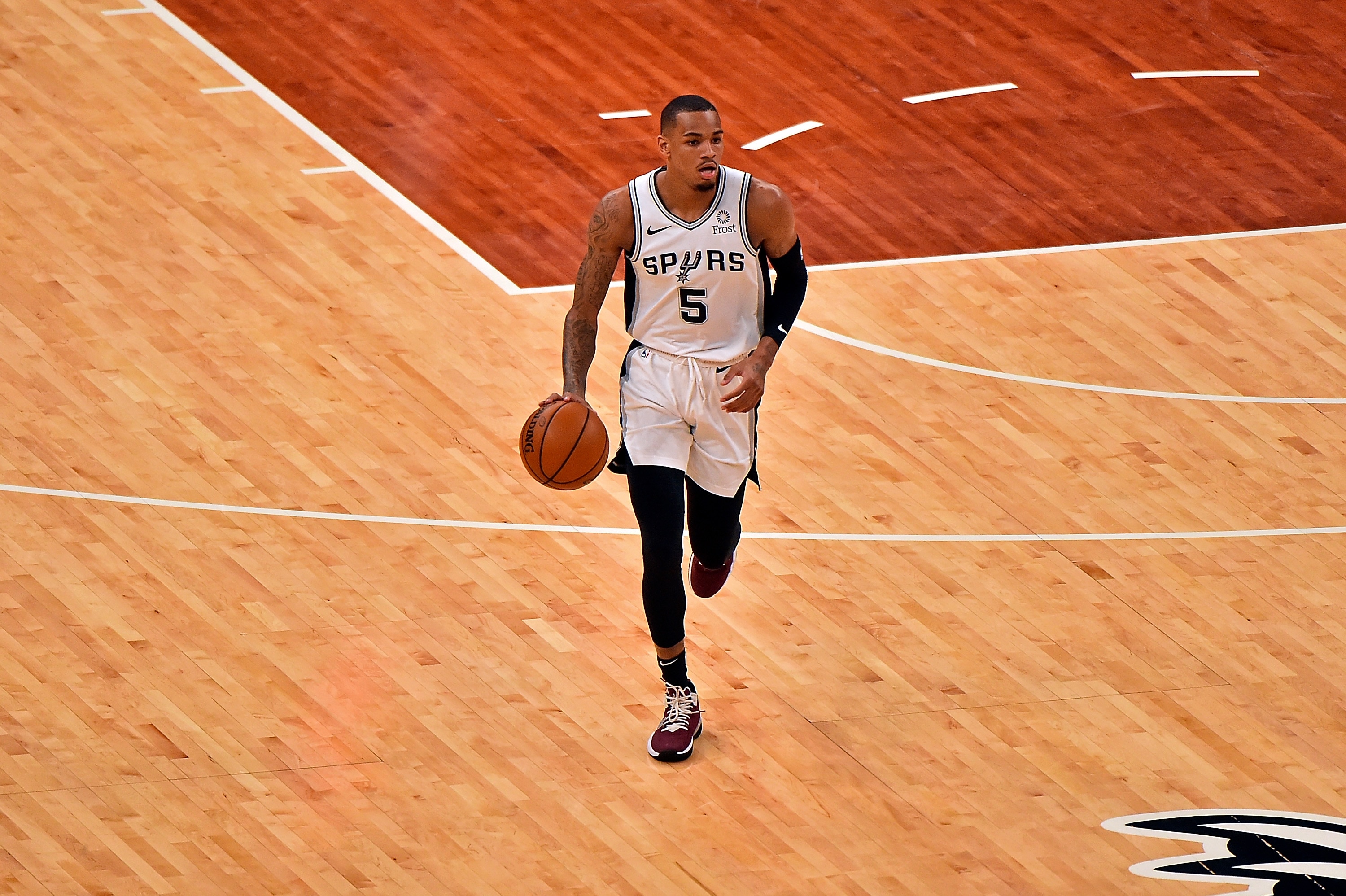MEMPHIS, TENNESSEE - MAY 19: Dejounte Murray #5 of the San Antonio Spurs brings the ball up court during the game of the play-in tournament game against the Memphis Grizzlies at FedExForum on May 19, 2021 in Memphis, Tennessee. NOTE TO USER: User expressly acknowledges and agrees that, by downloading and or using this photograph, User is consenting to the terms and conditions of the Getty Images License Agreement. (Photo by Justin Ford/Getty Images)