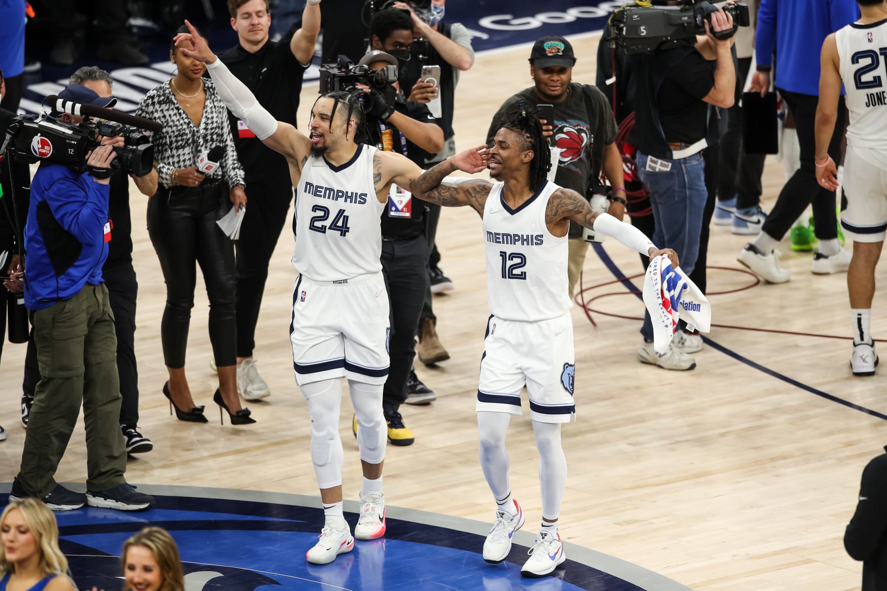 MINNEAPOLIS, MN - APRIL 29: Dillon Brooks #24 and Ja Morant #12 of the Memphis Grizzlies celebrate a 114-106 victory against the Minnesota Timberwolves to advance to the Western Conference Semifinals after Game Six of the Western Conference First Round at Target Center on April 29, 2022 in Minneapolis, Minnesota. NOTE TO USER: User expressly acknowledges and agrees that, by downloading and or using this Photograph, user is consenting to the terms and conditions of the Getty Images License Agreement. (Photo by David Berding/Getty Images)