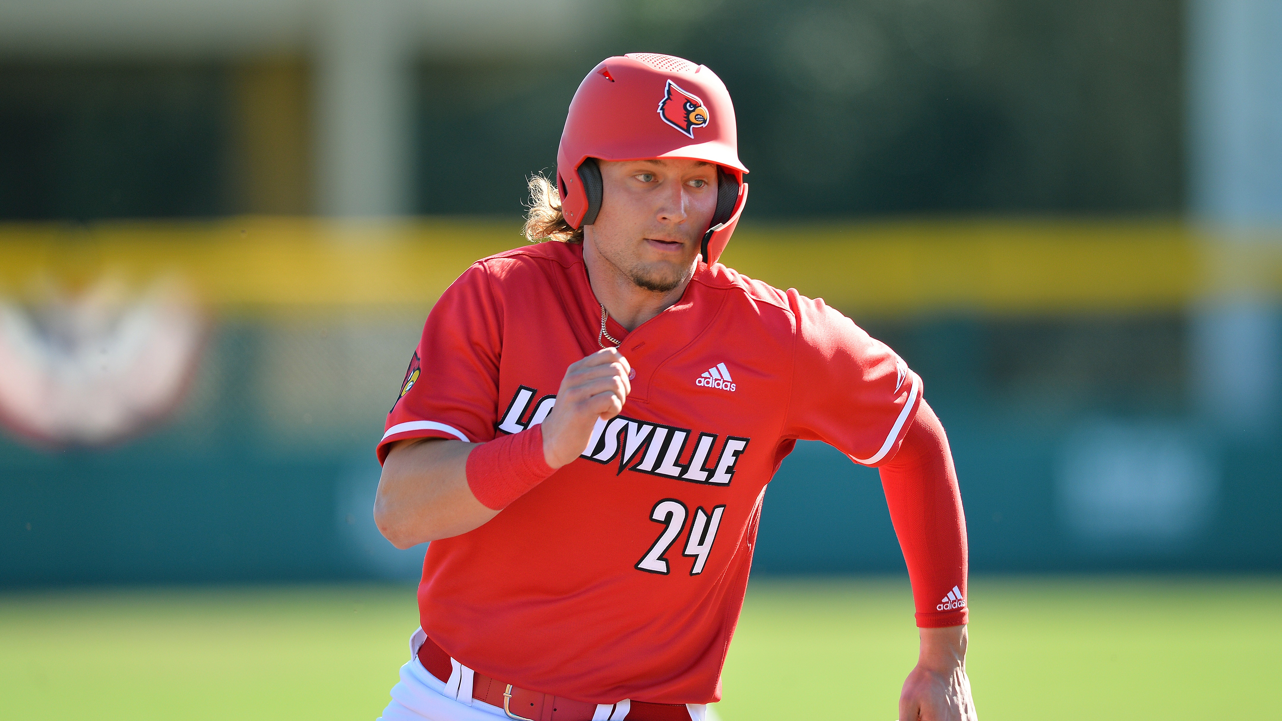 Louisville's Cameron Masterman (24) sprints to 3rd during an NCAA baseball game on Sunday, Feb. 20, 2022, in Tampa, Fla. (AP Photo/Kelly Sheehan)