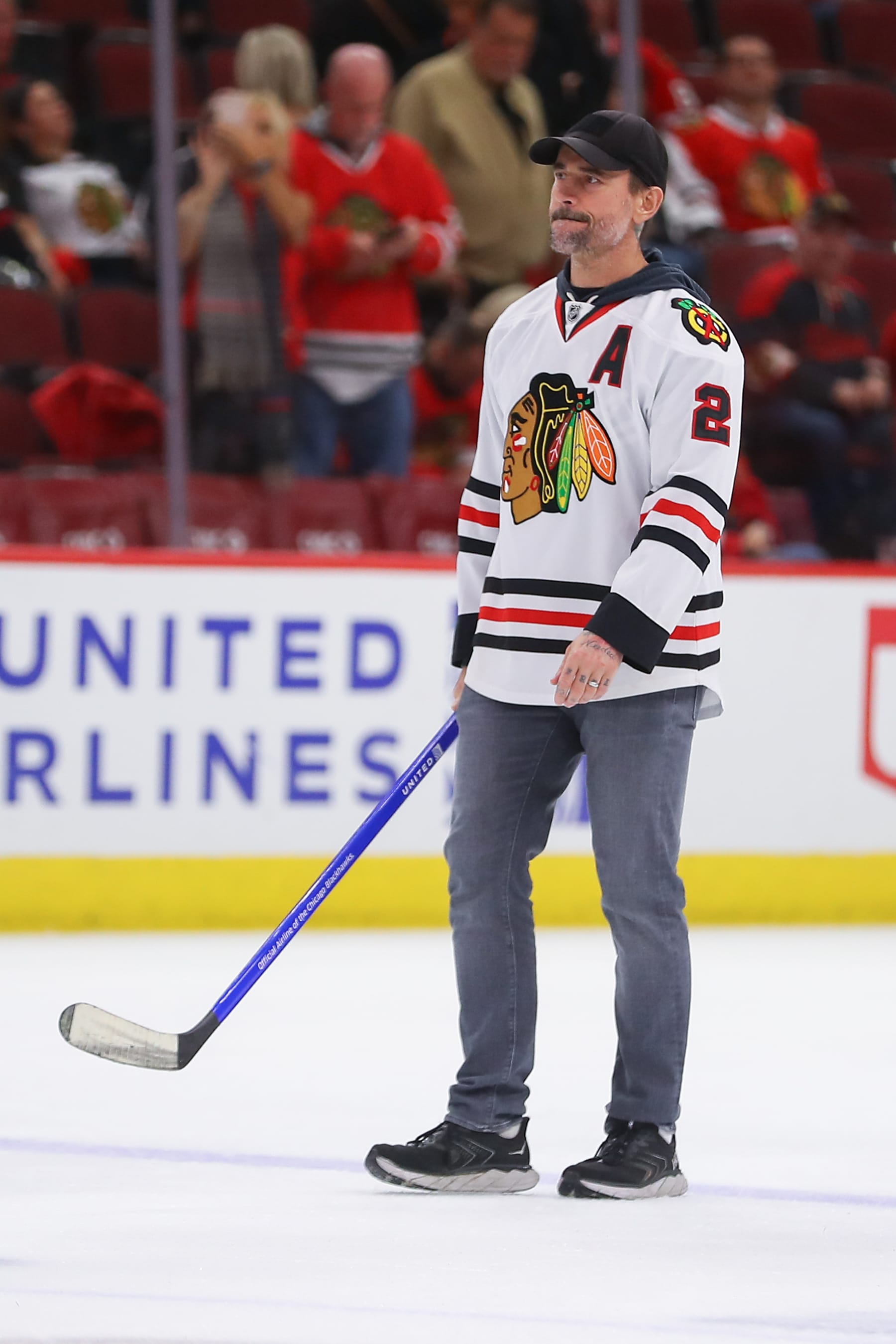 CHICAGO, IL - OCTOBER 21: Phil Brooks "CM Punk" walks onto the ice before shoot the puck during intermission during a game between the Vegas Golden Knights and the Chicago Blackhawks on October 21, 2023 at the United Center in Chicago, IL. (Photo by Melissa Tamez/Icon Sportswire via Getty Images)