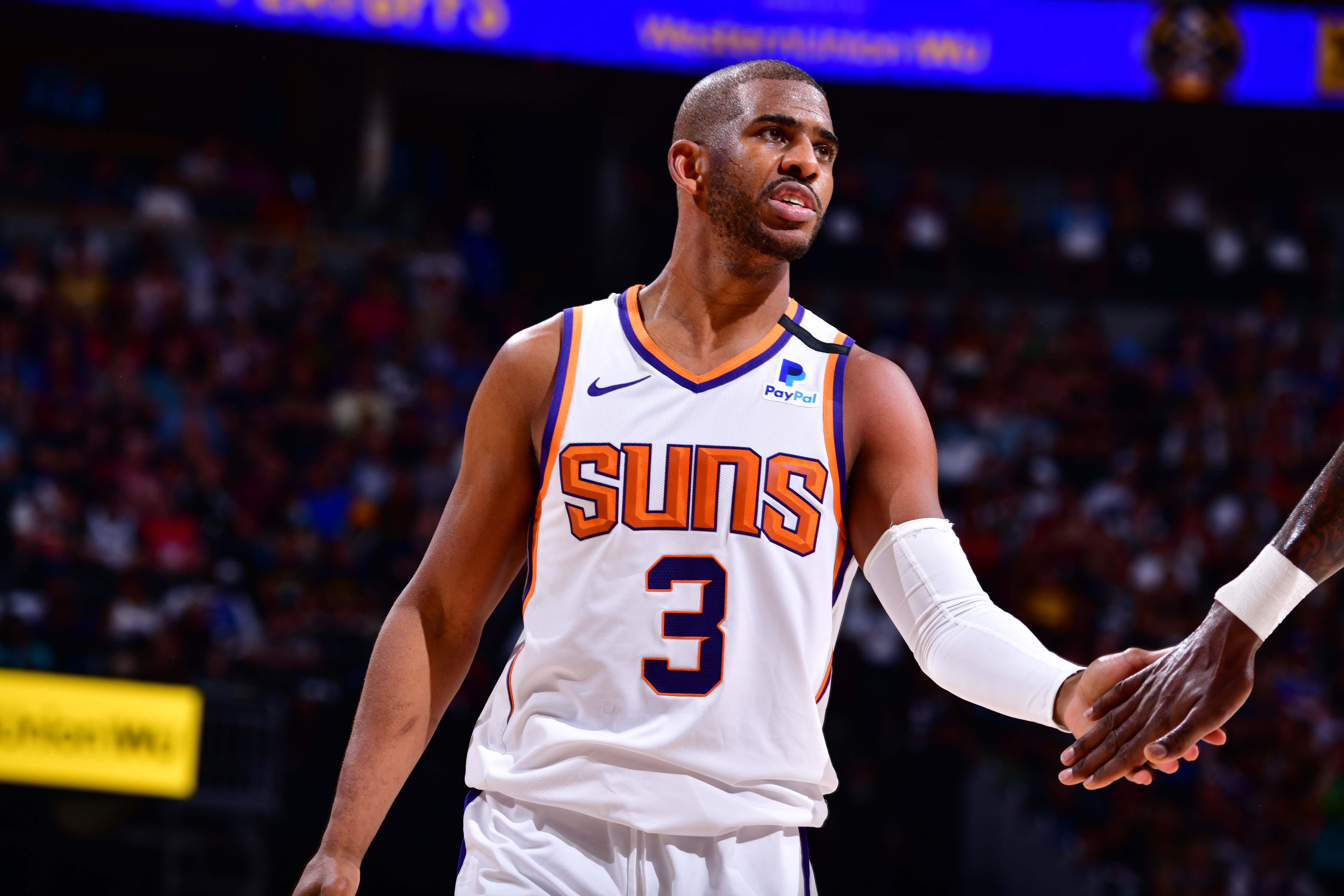 DENVER, CO - JUNE 13: Chris Paul #3 of the Phoenix Suns hi-fives teammates during Round 2, Game 4 of the 2021 NBA Playoffs on June 13, 2021 at the Ball Arena in Denver, Colorado. NOTE TO USER: User expressly acknowledges and agrees that, by downloading and/or using this Photograph, user is consenting to the terms and conditions of the Getty Images License Agreement. Mandatory Copyright Notice: Copyright 2021 NBAE (Photo by Barry Gossage/NBAE via Getty Images)