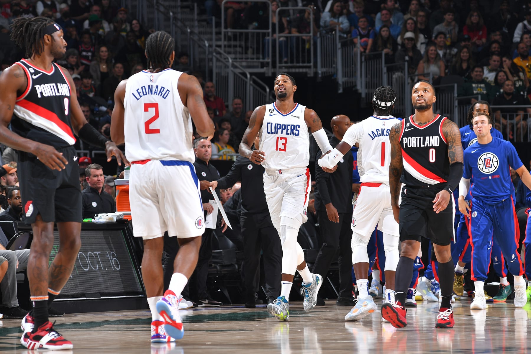 SEATTLE, WA - OCTOBER 3: Paul George #13 hi-fives Reggie Jackson #1 of the LA Clippers during a preseason game on October 3, 2022 at the Climate Pledge Arena in Seattle, Washington. NOTE TO USER: User expressly acknowledges and agrees that, by downloading and or using this photograph, user is consenting to the terms and conditions of the Getty Images License Agreement. Mandatory Copyright Notice: Copyright 2022 NBAE (Photos by Michael Gonzales/NBAE via Getty Images)