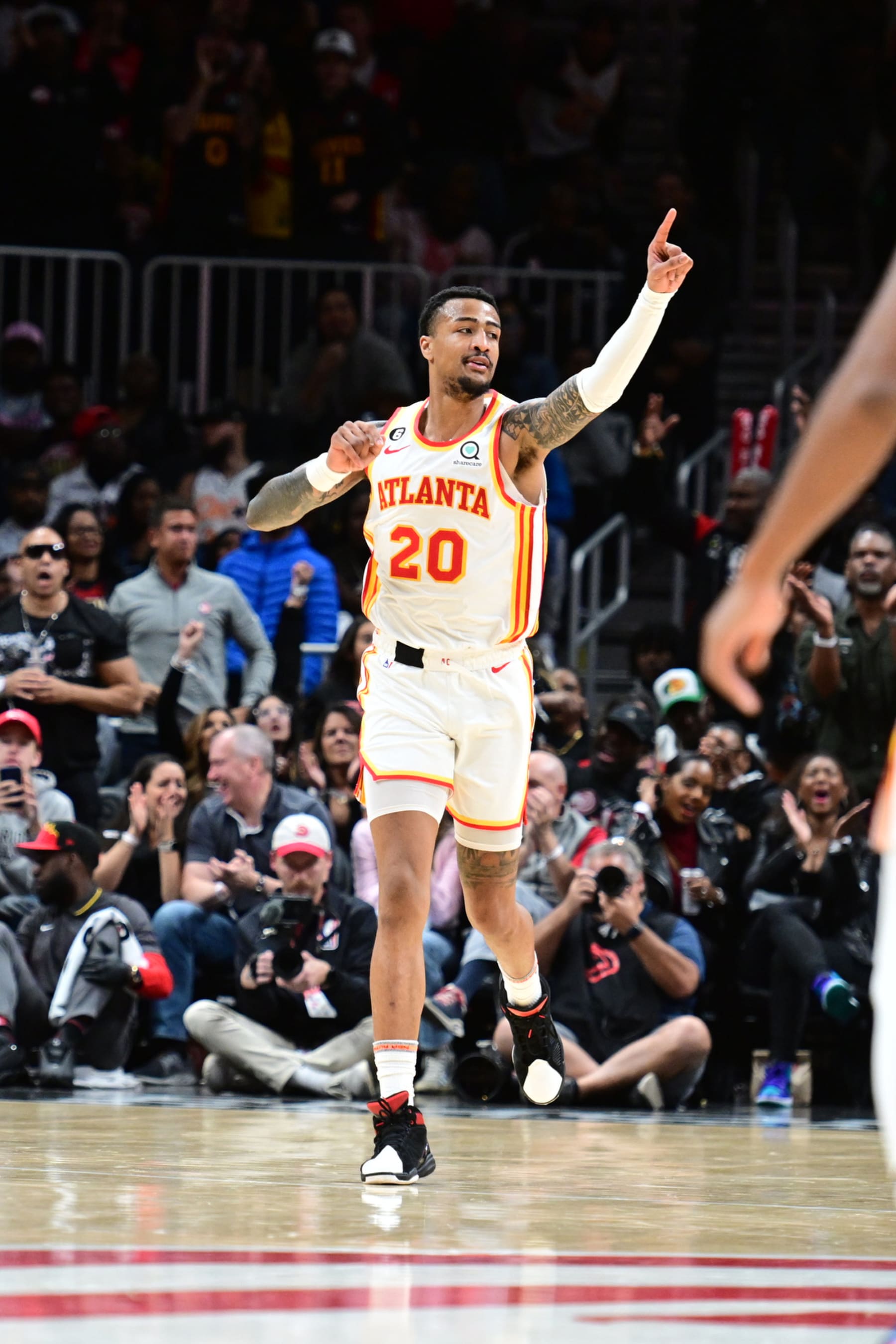 ATLANTA, GA - OCTOBER 21: John Collins #20 of the Atlanta Hawks celebrates against the Orlando Magic on October 21, 2022 at State Farm Arena in Atlanta, Georgia. NOTE TO USER: User expressly acknowledges and agrees that, by downloading and/or using this photograph, user is consenting to the terms and conditions of the Getty Images License Agreement. Mandatory Copyright Notice: Copyright 2022 NBAE (Photo by Adam Hagy/NBAE via Getty Images)