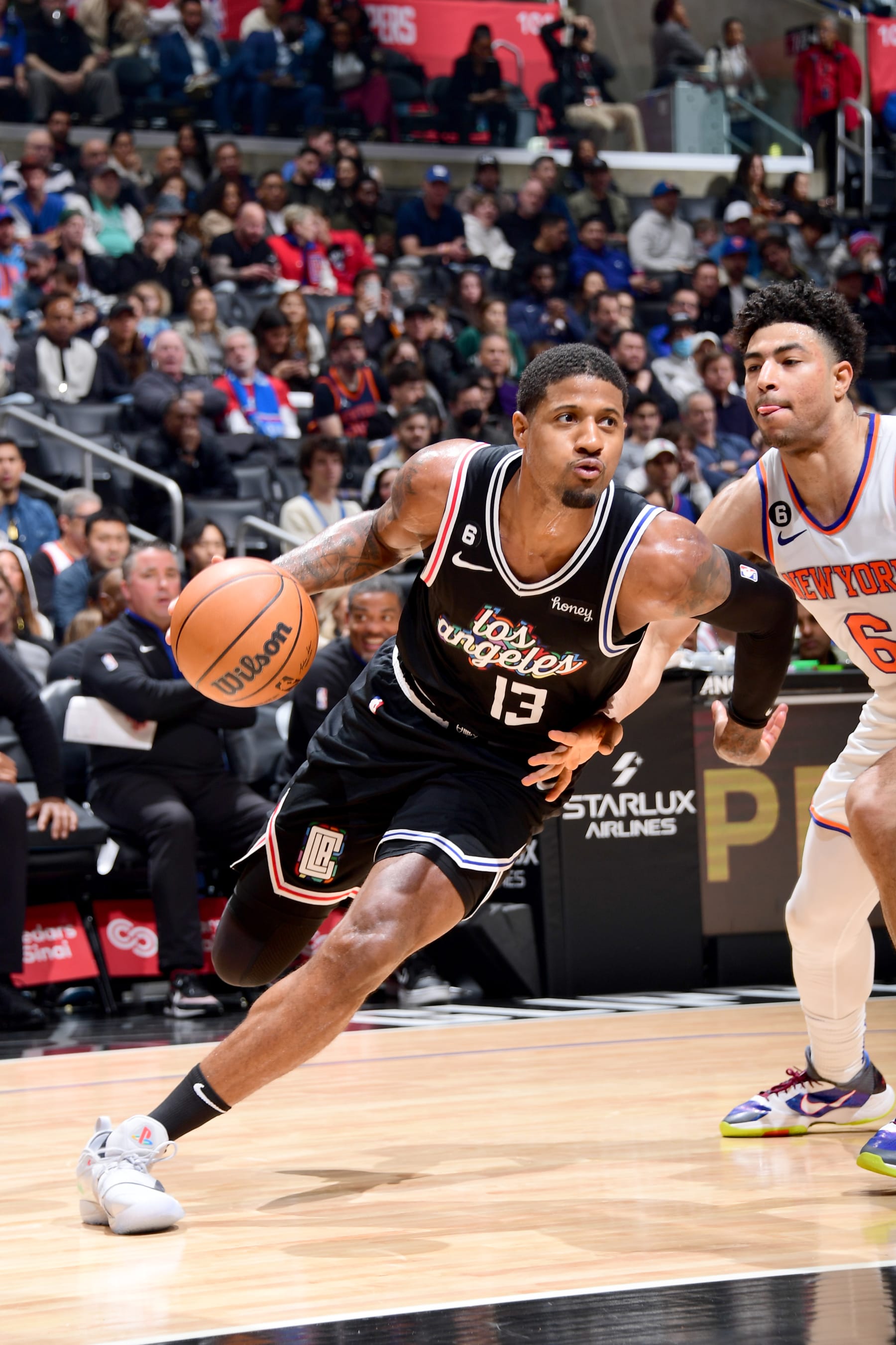 LOS ANGELES, CA - MARCH 11:  Paul George #13 of the LA Clippers drives to the basket against the New York Knicks on March 11, 2023 at Crypto.Com Arena in Los Angeles, California. NOTE TO USER: User expressly acknowledges and agrees that, by downloading and/or using this Photograph, user is consenting to the terms and conditions of the Getty Images License Agreement. Mandatory Copyright Notice: Copyright 2023 NBAE (Photo by Adam Pantozzi/NBAE via Getty Images)