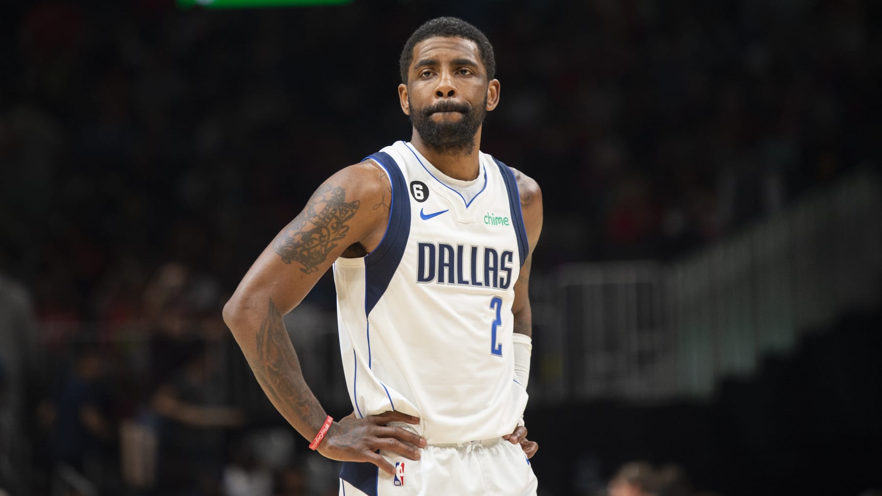 Dallas Mavericks guard Kyrie Irving looks down court during the second half of an NBA basketball game against the Atlanta Hawks, Sunday, April 2, 2023, in Atlanta. (AP Photo/Hakim Wright Sr.)