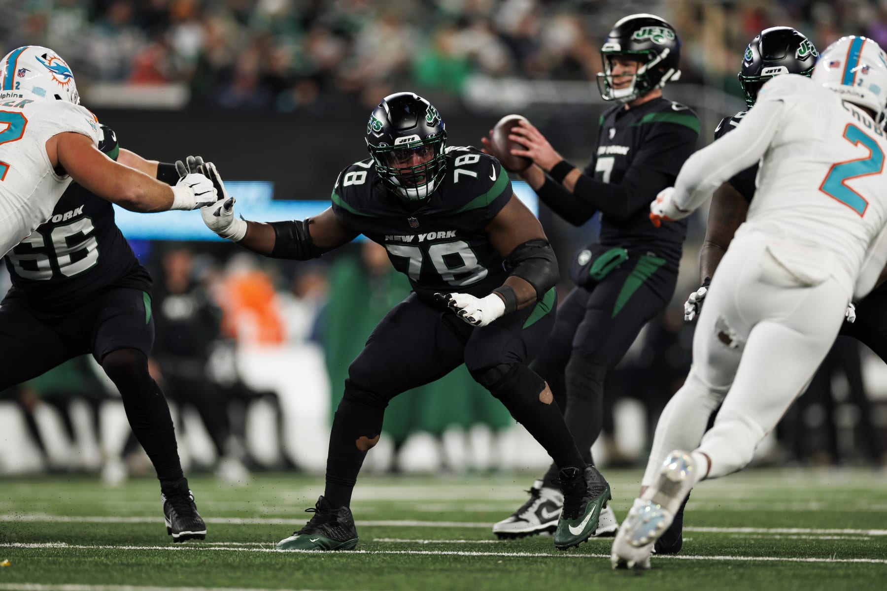 EAST RUTHERFORD, NEW JERSEY - NOVEMBER 24: Laken Tomlinson #78 of the New York Jets blocks during an NFL football game against the Miami Dolphins at MetLife Stadium on November 24, 2023 in East Rutherford, New Jersey. (Photo by Ryan Kang/Getty Images)