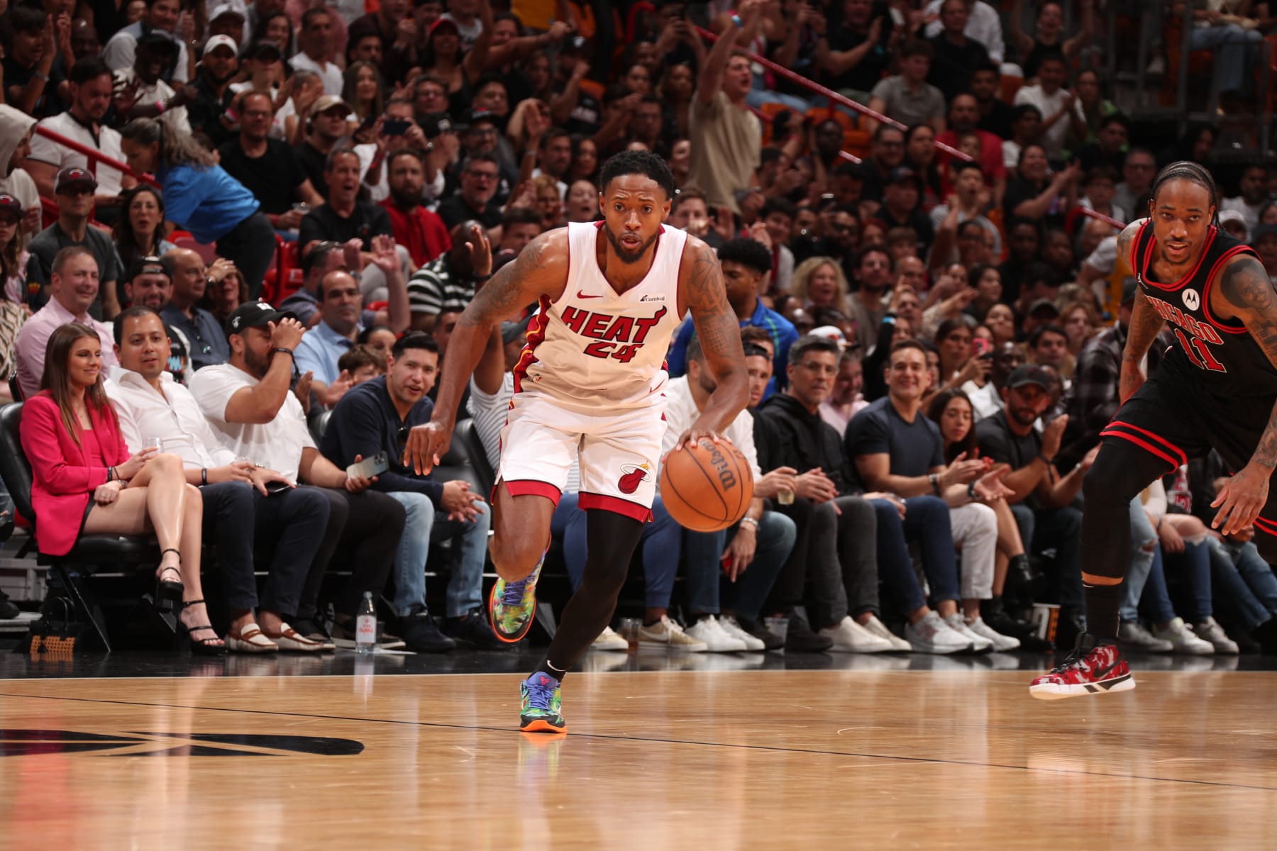 MIAMI, FL - APRIL 19: Haywood Highsmith #24 of the Miami Heat dribbles the ball during the game against the Chicago Bulls during the 2024 Play-In Tournament on April 19, 2024 at Kaseya Center in Miami, Florida. NOTE TO USER: User expressly acknowledges and agrees that, by downloading and or using this Photograph, user is consenting to the terms and conditions of the Getty Images License Agreement. Mandatory Copyright Notice: Copyright 2024 NBAE (Photo by Issac Baldizon/NBAE via Getty Images)