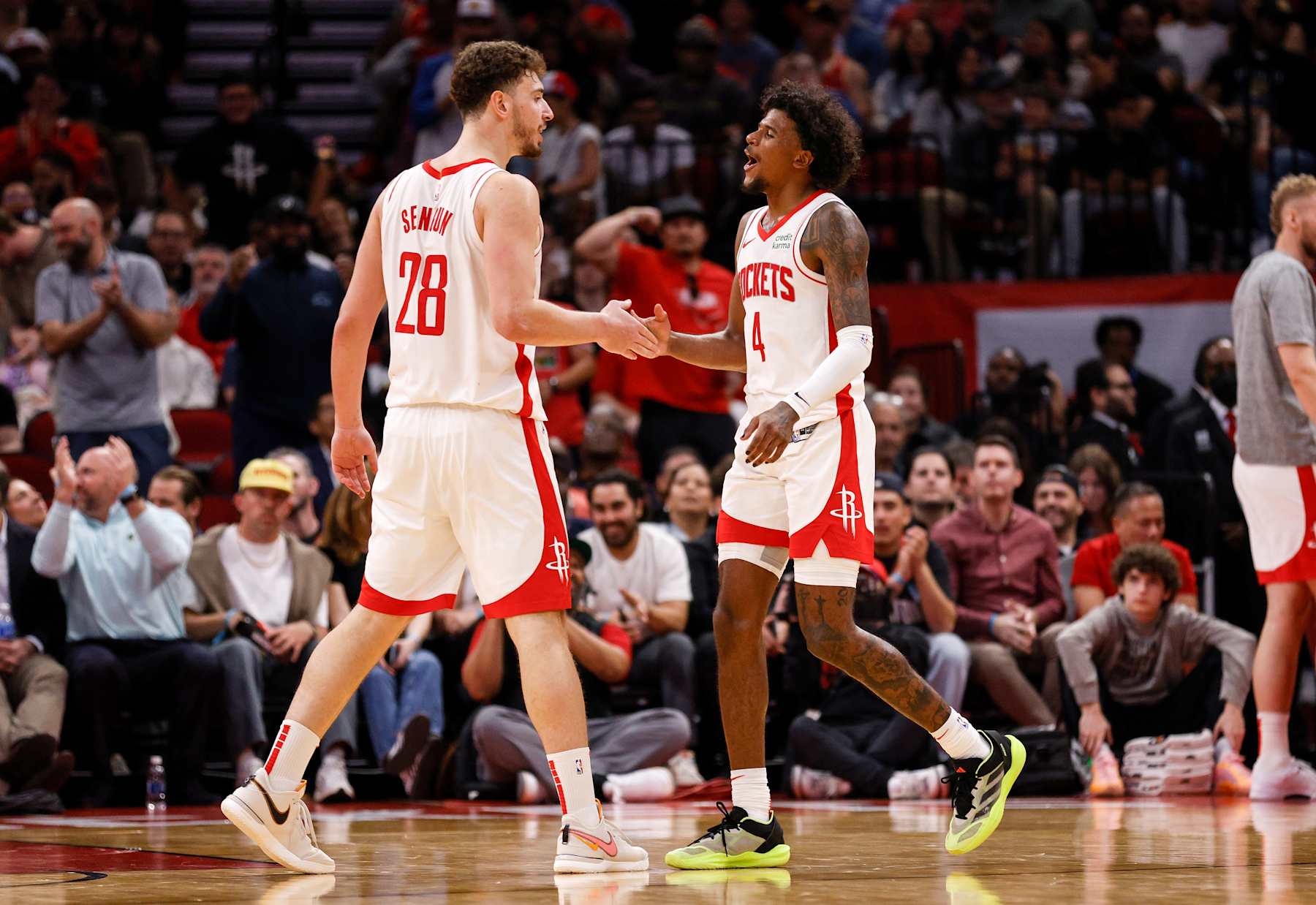 HOUSTON, TEXAS - MARCH 05: Alperen Sengun #28 of the Houston Rockets is congratulated by Jalen Green #4 in the second half against the San Antonio Spurs at Toyota Center on March 05, 2024 in Houston, Texas.  NOTE TO USER: User expressly acknowledges and agrees that, by downloading and or using this photograph, User is consenting to the terms and conditions of the Getty Images License Agreement. (Photo by Tim Warner/Getty Images)