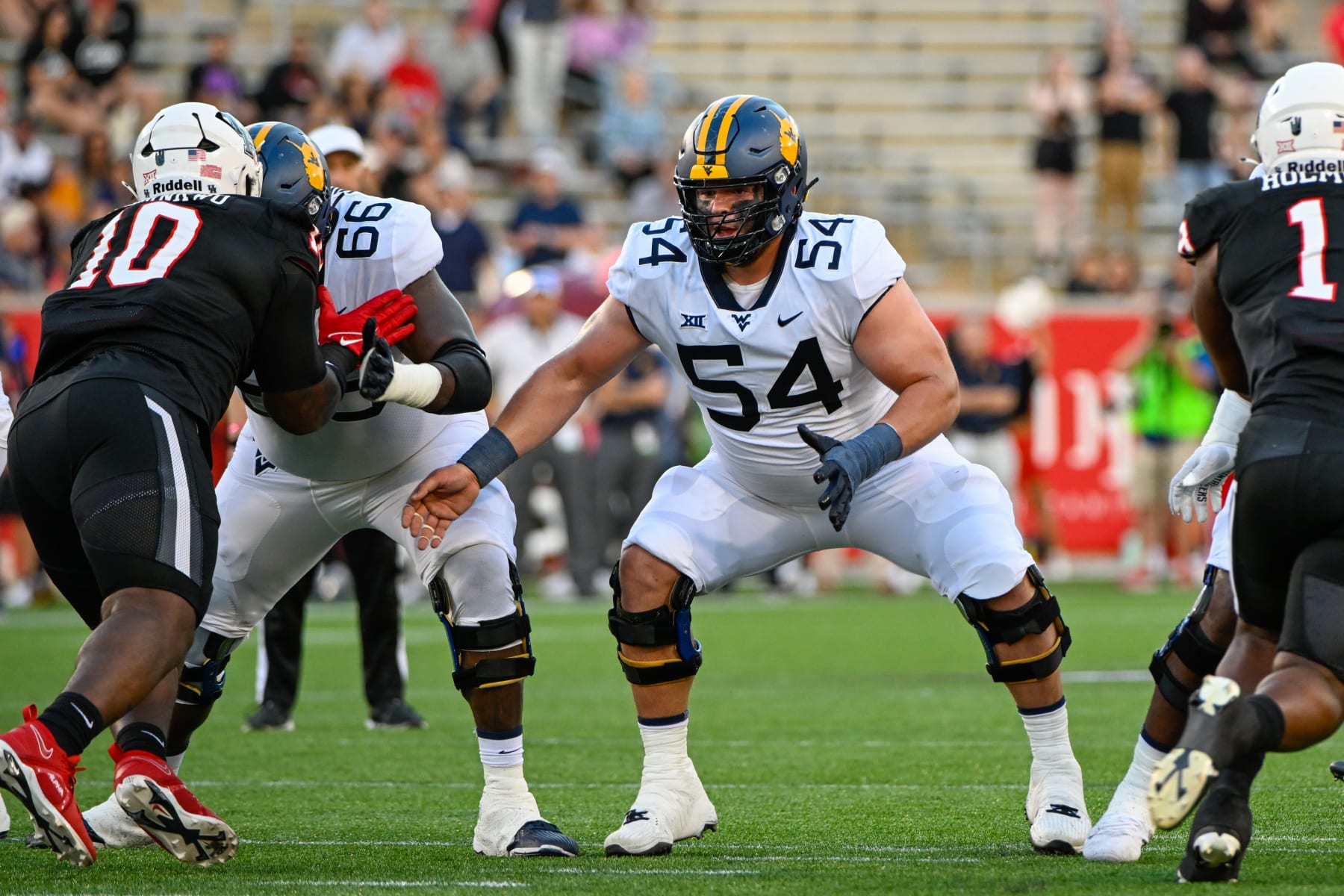HOUSTON, TX - OCTOBER 12: West Virginia Mountaineers offensive lineman Zach Frazier (54) prepares to block during the football game between the West Virginia Mountaineers and Houston Cougars at TDECU Stadium on October 12, 2023, in Houston, Texas. (Photo by Ken Murray/Icon Sportswire via Getty Images)