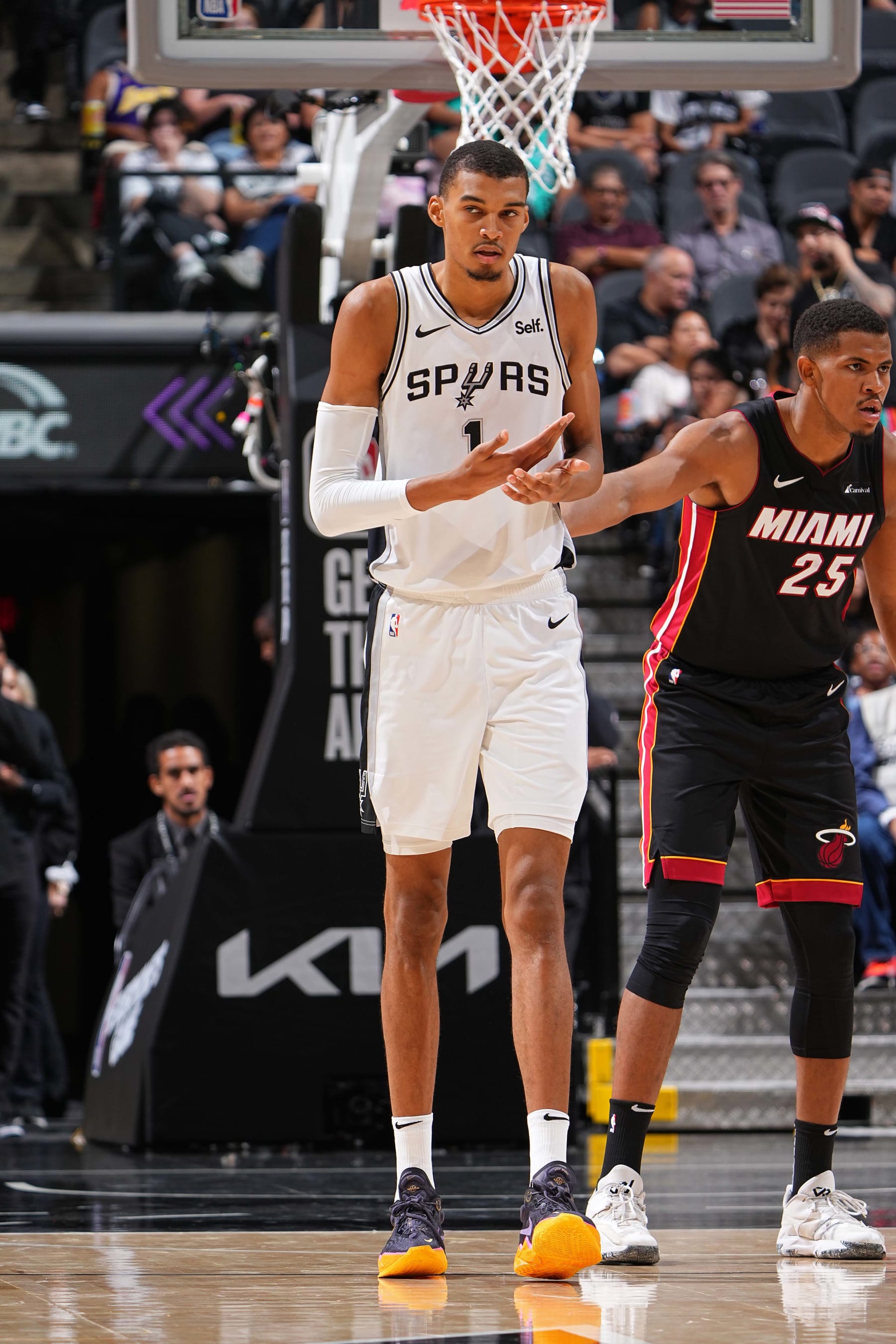 SAN ANTONIO, TX - OCTOBER 13: Victor Wembanyama #1 of the San Antonio Spurs looks on during the game against the Miami Heat on October 13, 2023 at the Frost Bank Center in San Antonio, Texas. NOTE TO USER: User expressly acknowledges and agrees that, by downloading and/or using this Photograph, user is consenting to the terms and conditions of the Getty Images License Agreement. Mandatory Copyright Notice: Copyright 2023 NBAE (Photo by Garrett Ellwood/NBAE via Getty Images)