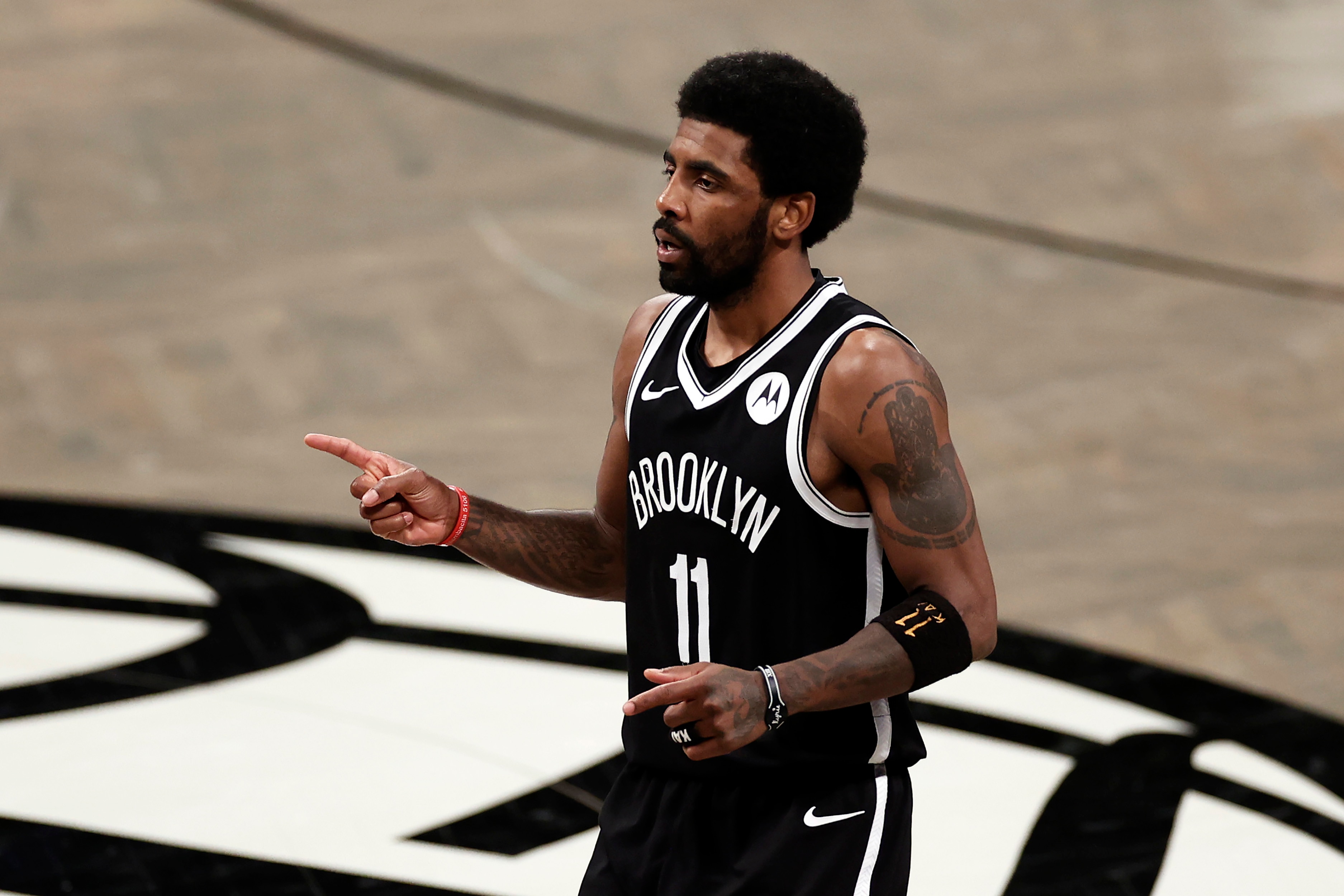 Brooklyn Nets guard Kyrie Irving (11) reacts against the Milwaukee Bucks during the second half of Game 1 of an NBA basketball second-round playoff series Saturday, June 5, 2021, in New York. (AP Photo/Adam Hunger)