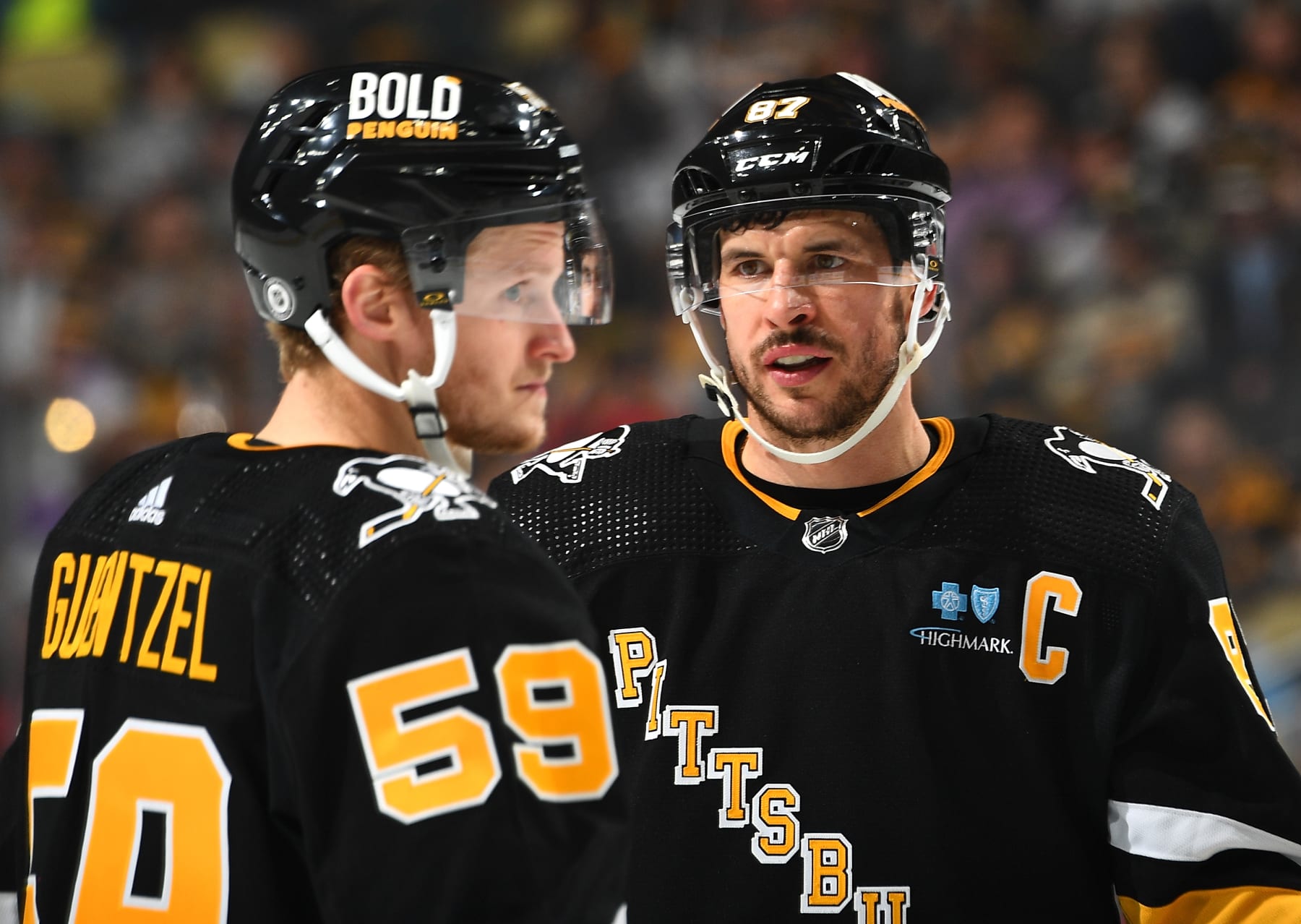 PITTSBURGH, PA - NOVEMBER 16:  Sidney Crosby #87 talks with Jake Guentzel #59 of the Pittsburgh Penguins during the game against the New Jersey Devils at PPG PAINTS Arena on November 16, 2023 in Pittsburgh, Pennsylvania. (Photo by Joe Sargent/NHLI via Getty Images)