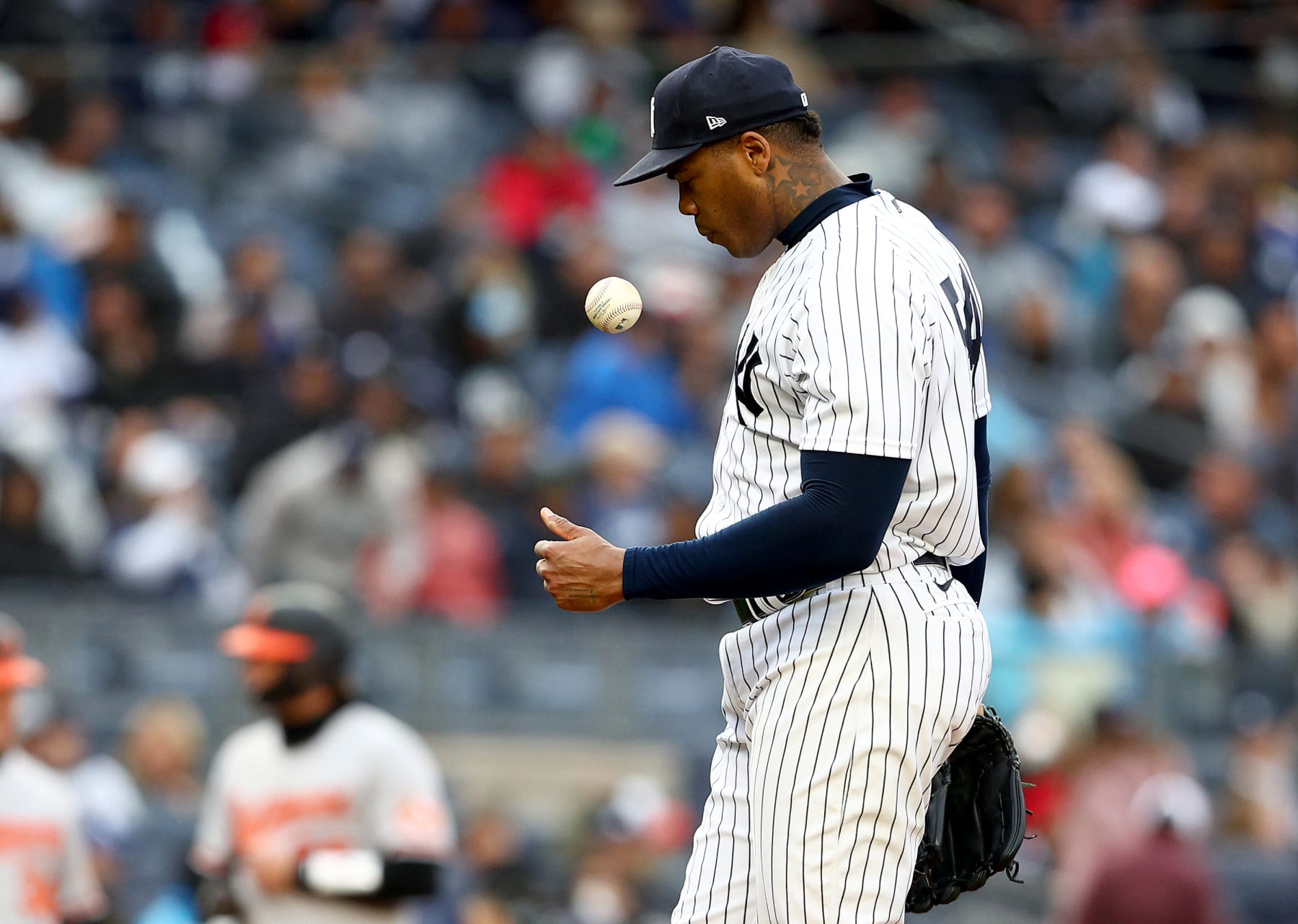 NEW YORK, NEW YORK - OCTOBER 02:  Aroldis Chapman #54 of the New York reacts after he walked Gunnar Henderson of the Baltimore Orioles with the bases loaded to score a run in the seventh inning against the Baltimore Orioles at Yankee Stadium on October 02, 2022 in the Bronx borough of New York City. (Photo by Elsa/Getty Images)
