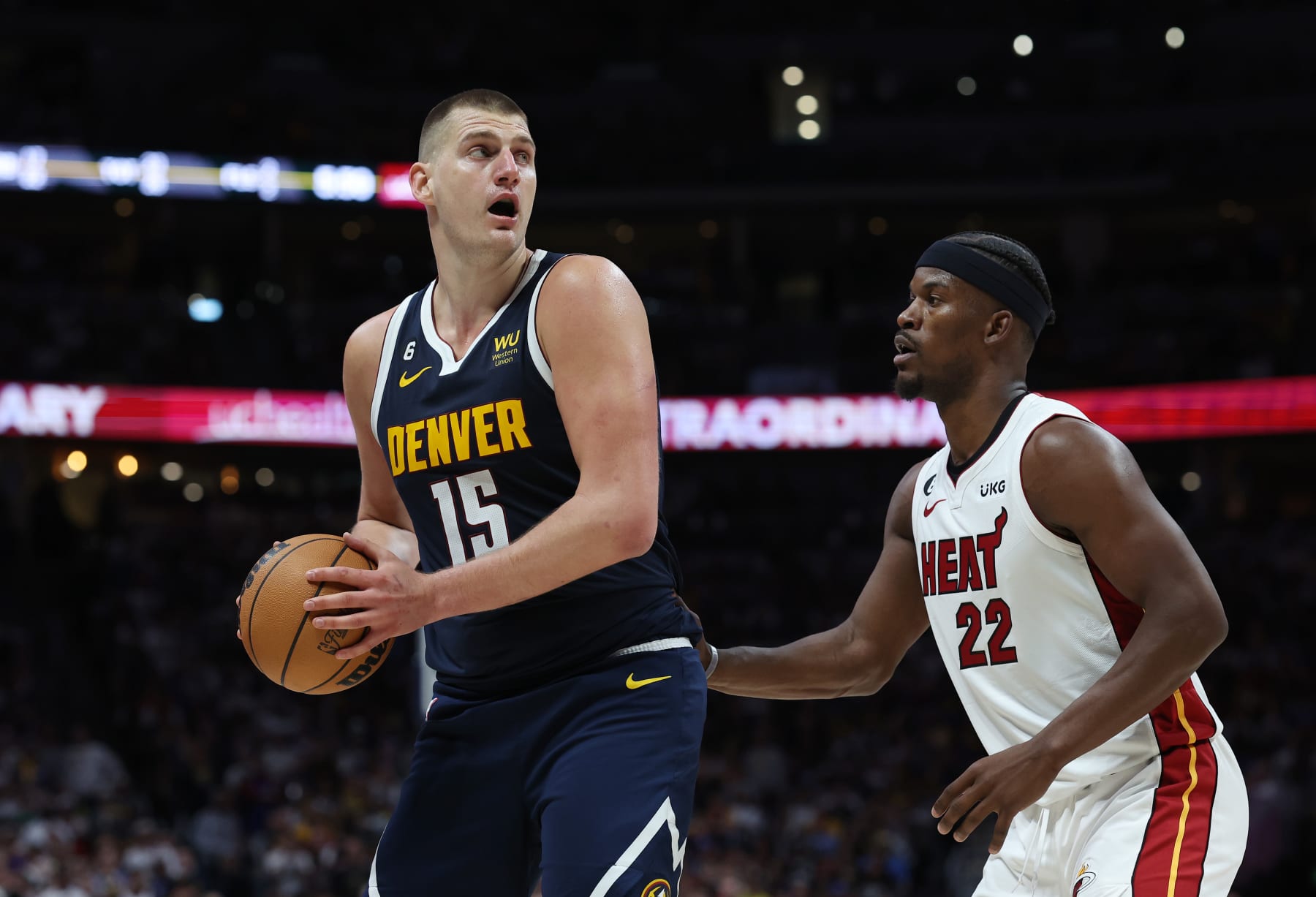 DENVER, COLORADO - JUNE 04: Jimmy Butler #22 of the Miami Heat defends against Nikola Jokic #15 of the Denver Nuggets during the third quarter in Game Two of the 2023 NBA Finals at Ball Arena on June 04, 2023 in Denver, Colorado. NOTE TO USER: User expressly acknowledges and agrees that, by downloading and or using this photograph, User is consenting to the terms and conditions of the Getty Images License Agreement. (Photo by Matthew Stockman/Getty Images)