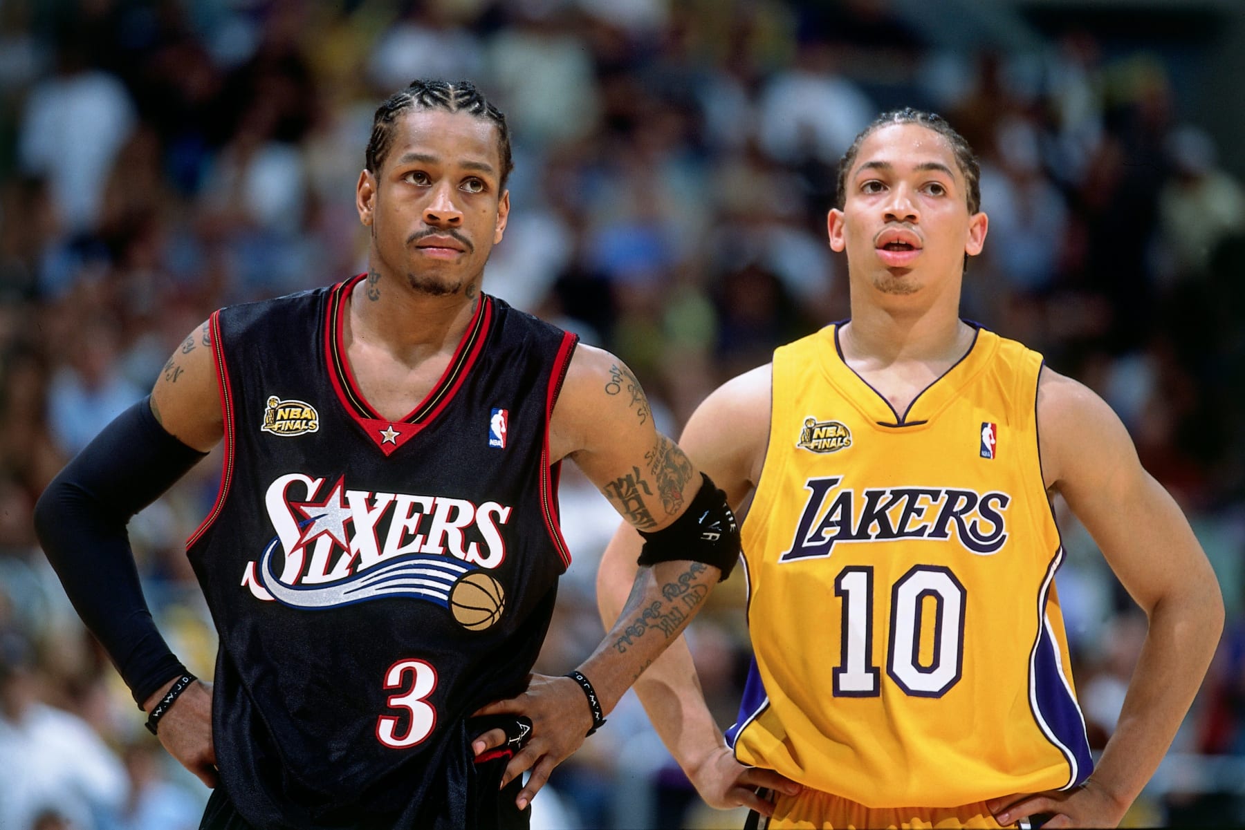 LOS ANGELES - JUNE 6:  Allen Iverson #3 of the Philadelphia 76ers stands with Tyronn Lue #10 of the Los Angeles Lakers during game one of the 2001 NBA Finals played June 6, 2001 at the Staples Center in Los Angeles, California.  NOTE TO USER: User expressly acknowledges that, by downloading and or using this photograph, User is consenting to the terms and conditions of the Getty Images License agreement. Mandatory Copyright Notice: Copyright 2001 NBAE (Photo by Nathaniel S. Butler/NBAE via Getty Images)