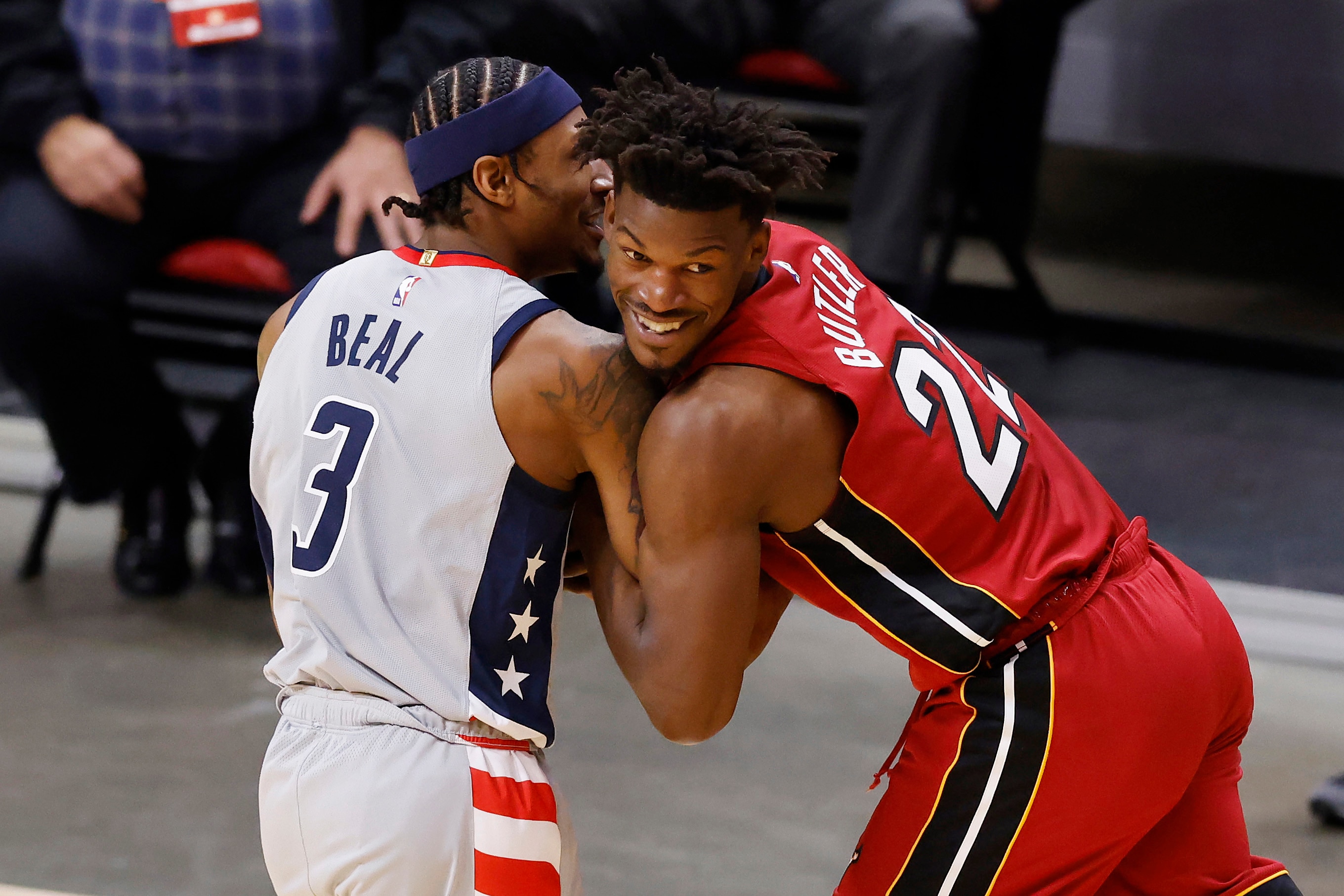 MIAMI, FLORIDA - FEBRUARY 03: Bradley Beal #3 of the Washington Wizards and Jimmy Butler #22 of the Miami Heat battle for the ball during the second quarter at American Airlines Arena on February 03, 2021 in Miami, Florida. NOTE TO USER: User expressly acknowledges and agrees that, by downloading and or using this photograph, User is consenting to the terms and conditions of the Getty Images License Agreement.  (Photo by Michael Reaves/Getty Images)