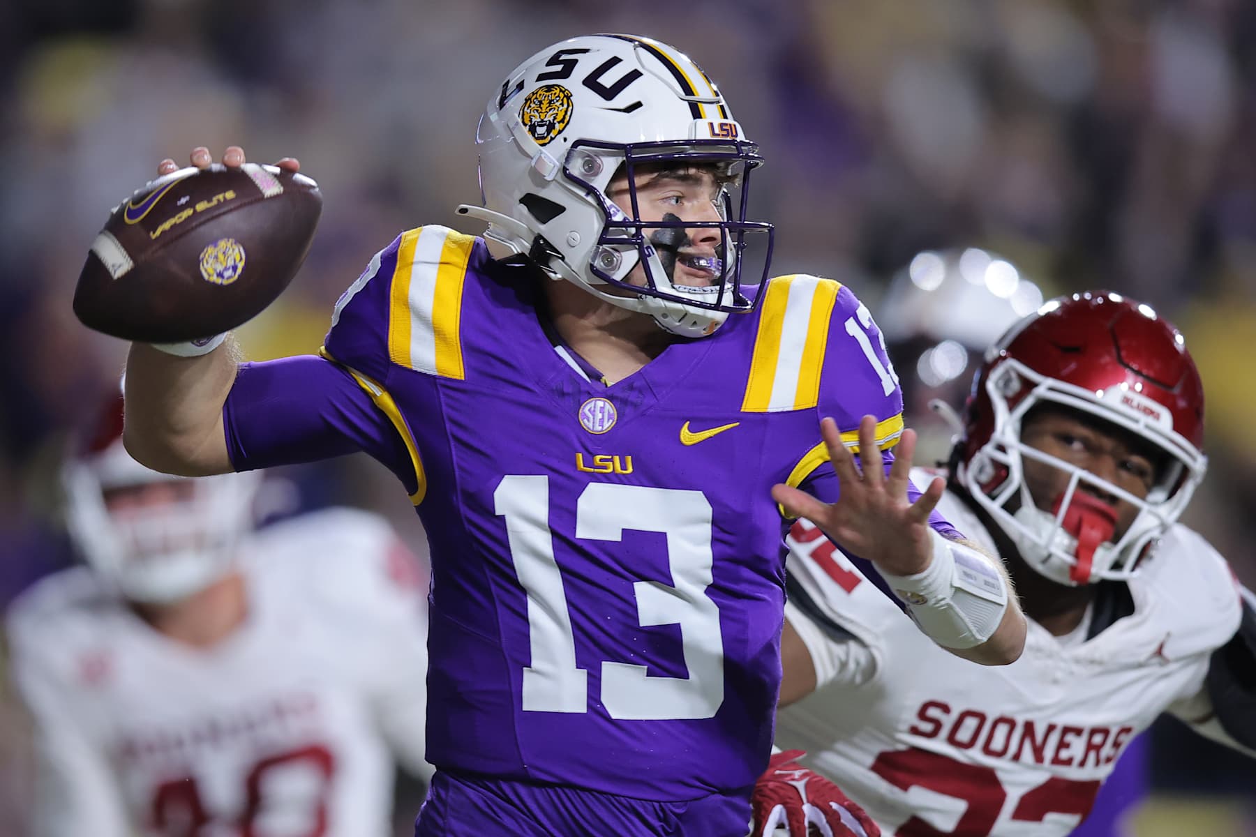 BATON ROUGE, LOUISIANA - NOVEMBER 30: Garrett Nussmeier #13 of the LSU Tigers throws the ball during the first half against the Oklahoma Sooners at Tiger Stadium on November 30, 2024 in Baton Rouge, Louisiana. (Photo by Jonathan Bachman/Getty Images)