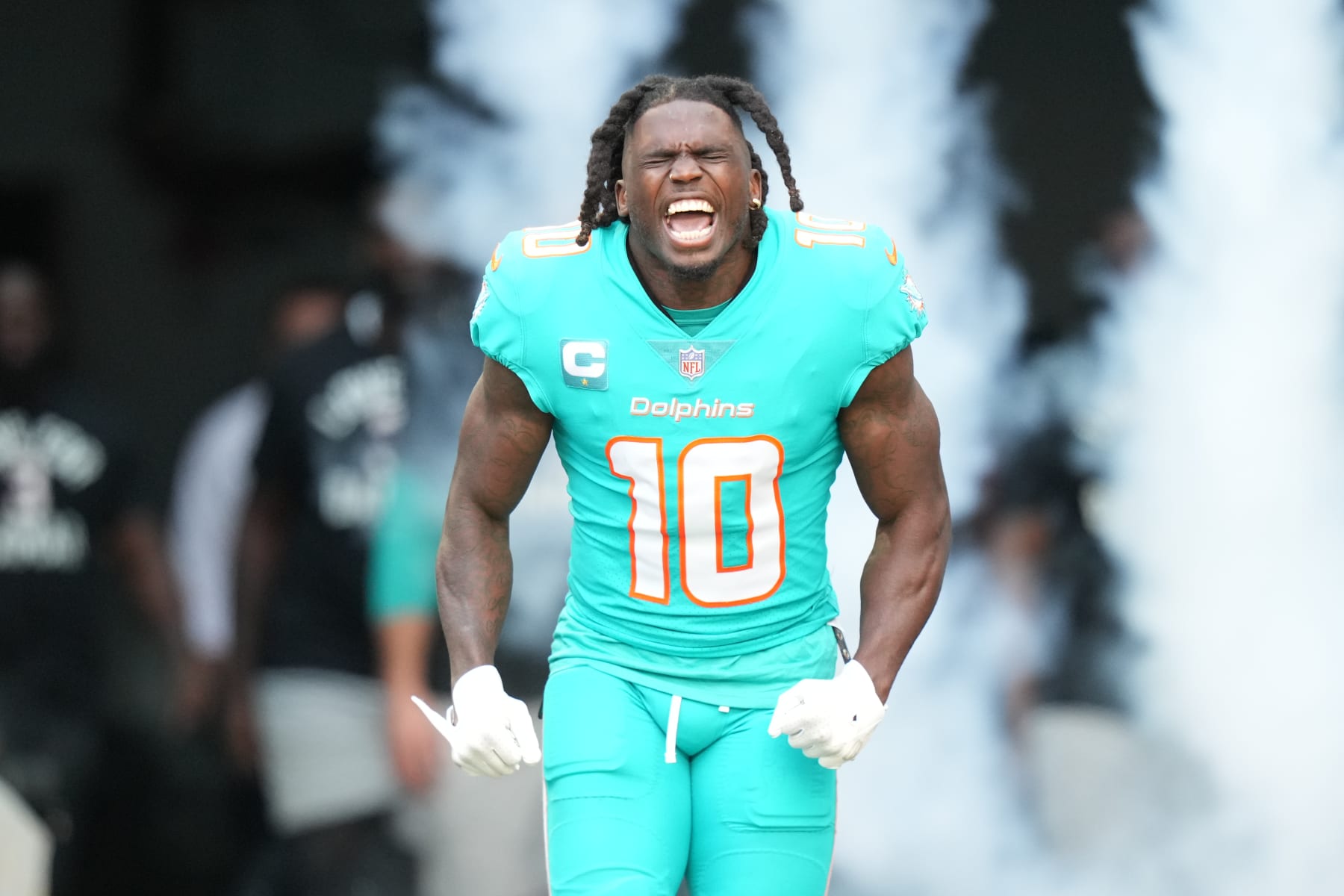 MIAMI GARDENS, FL - JANUARY 08: Miami Dolphins wide receiver Tyreek Hill (10) tries to excite the crowd during pregame introductions before the game between the New York Jets and the Miami Dolphins on Sunday, January 8, 2023 at Hard Rock Stadium, Miami Gardens, Fla. (Photo by Peter Joneleit/Icon Sportswire via Getty Images)