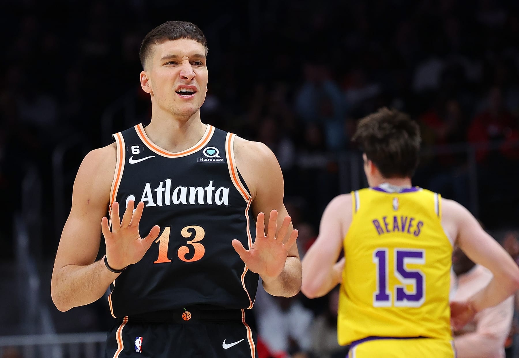 ATLANTA, GEORGIA - DECEMBER 30:  Bogdan Bogdanovic #13 of the Atlanta Hawks reacts after a three-point basket against the Los Angeles Lakers during the first quarter at State Farm Arena on December 30, 2022 in Atlanta, Georgia.  NOTE TO USER: User expressly acknowledges and agrees that, by downloading and or using this photograph, User is consenting to the terms and conditions of the Getty Images License Agreement.  (Photo by Kevin C. Cox/Getty Images)