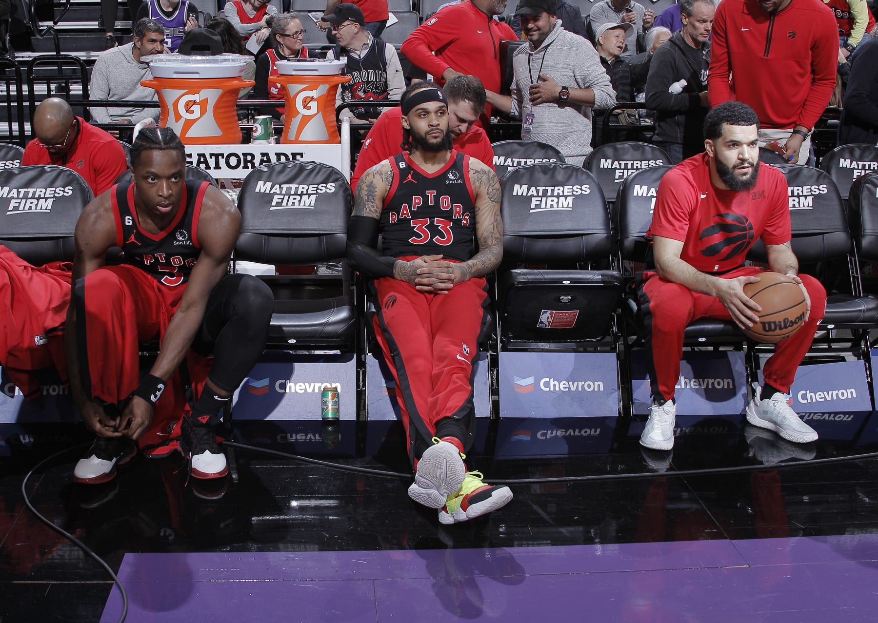 SACRAMENTO, CA - JANUARY 25: O.G. Anunoby #3, Gary Trent Jr. #33, and Fred VanVleet #23 of the Toronto Raptors sitting on the bench prior to the game against the Sacramento Kings on January 25, 2023 at Golden 1 Center in Sacramento, California. NOTE TO USER: User expressly acknowledges and agrees that, by downloading and or using this photograph, User is consenting to the terms and conditions of the Getty Images Agreement. Mandatory Copyright Notice: Copyright 2023 NBAE (Photo by Rocky Widner/NBAE via Getty Images)
