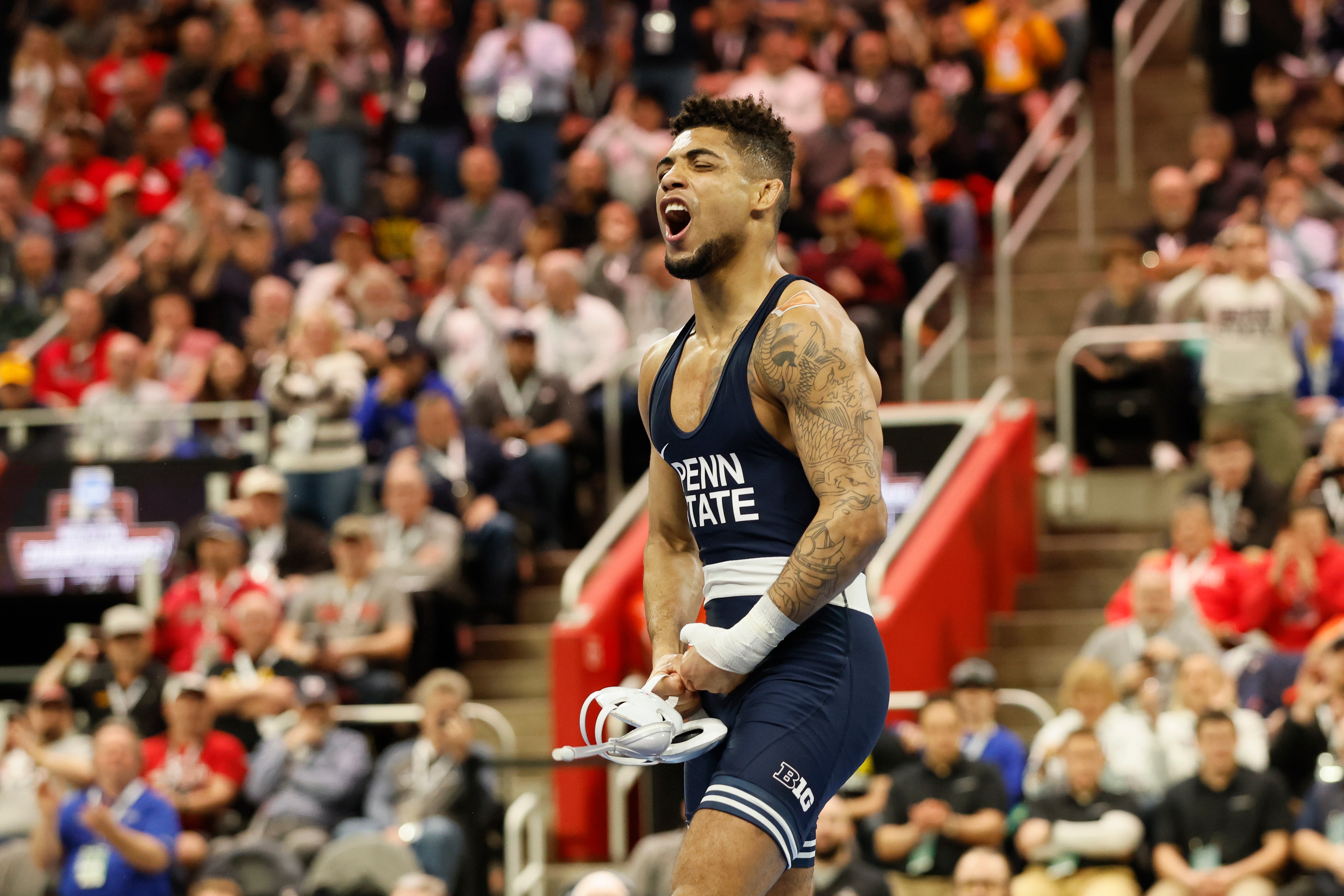 DETROIT, MI - MARCH 19: Roman Bravo-Young of the Penn State Nittany Lions defeats Daton Fix of the Oklahoma State Cowboys in the 133-pound final match during the Division I Mens Wrestling Championship held at Little Caesars Arena on March 19, 2022 in Detroit, Michigan. (Photo by Jay LaPrete/NCAA Photos/NCAA Photos via Getty Images)