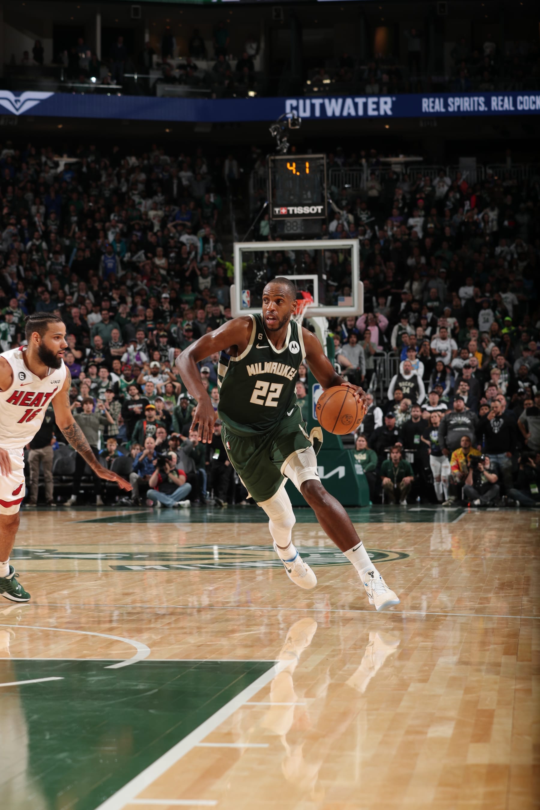 MILWAUKEE, WI - APRIL 26: Khris Middleton #22 of the Milwaukee Bucks drives to the basket during Round One Game Five of the 2023 NBA Playoffs on April 26, 2023 at the Fiserv Forum Center in Milwaukee, Wisconsin. NOTE TO USER: User expressly acknowledges and agrees that, by downloading and or using this Photograph, user is consenting to the terms and conditions of the Getty Images License Agreement. Mandatory Copyright Notice: Copyright 2023 NBAE (Photo by Gary Dineen/NBAE via Getty Images).