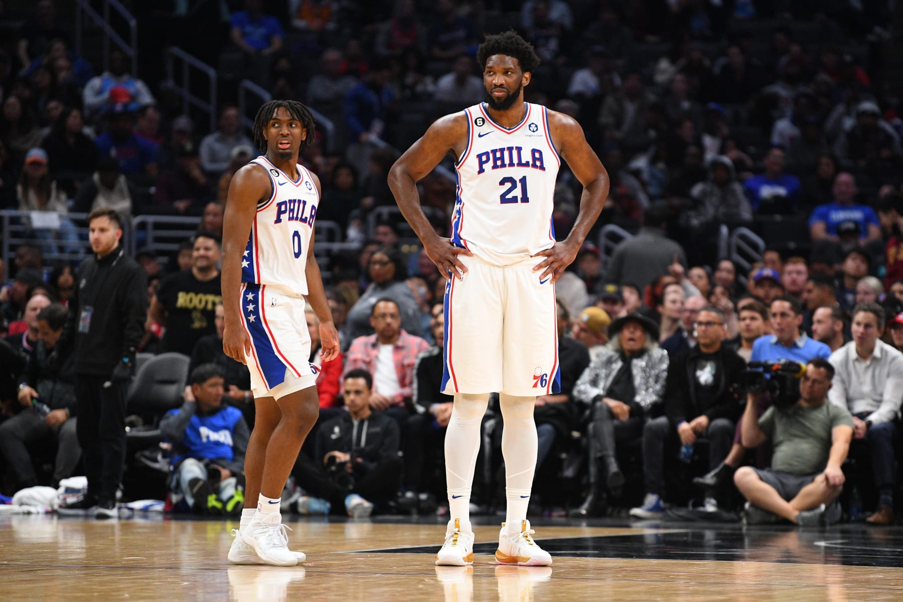 LOS ANGELES, CA - JANUARY 17: Philadelphia 76ers Center Joel Embiid (21) and Philadelphia 76ers Guard Tyrese Maxey (0) look on during a NBA game between the Philadelphia 76ers and the Los Angeles Clippers on January 17, 2023 at Crypto.com Arena in Los Angeles, CA. (Photo by Brian Rothmuller/Icon Sportswire via Getty Images)