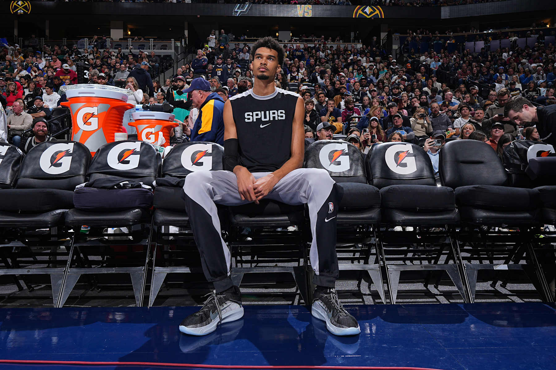 DENVER, CO - JANUARY 3: Victor Wembanyama #1 of the San Antonio Spurs looks on before the game against the Denver Nuggets on January 3, 2025 at Ball Arena in Denver, Colorado. NOTE TO USER: User expressly acknowledges and agrees that, by downloading and/or using this Photograph, user is consenting to the terms and conditions of the Getty Images License Agreement. Mandatory Copyright Notice: Copyright 2025 NBAE (Photo by Garrett Ellwood/NBAE via Getty Images)